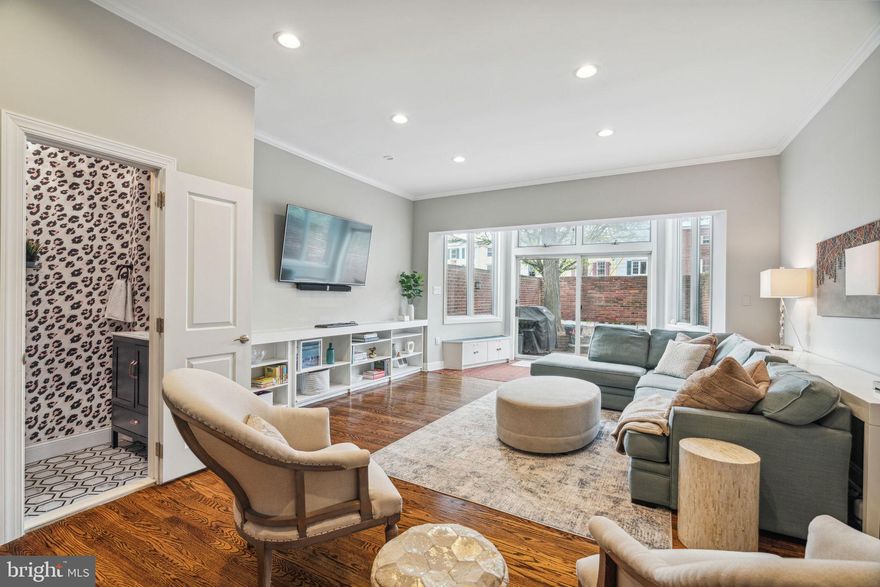 Expansive, light-filled, Rittenhouse Square neighborhood home in the coveted Greenfield catchment features 3 bedrooms plus 2 bonus spaces, 2.5 baths, a huge back patio, and transferrable parking one block away! A renovation just 5 years young turned this former duplex into a home that city dreams are made of! Enter through the gated breezeway, and as you make your way to the home’s entrance, you’ll find a closet that keeps your trash and recycling out of sight. Once inside, you will be greeted by beautifully refinished hardwood floors, 10’ ceilings, and a fully renovated kitchen that boasts ample custom cabinetry, a 9’ wide window with a reclaimed-wood deep sill that’s perfect for your potted herbs and plants, counter-to-ceiling mermaid tile backsplash, and waterfall quartz countertops with peninsula where your friends can look on while you create culinary masterpieces. The adjoining dining area, with exposed brick, comfortably seats 8-10 people so hosting your next dinner party or family holiday will be a breeze. Continue to the bright and spacious living room, with built-in shelving, coat closet and wood-burning fireplace, which looks onto the south-facing brick patio, an ideal backdrop for dining al fresco or enjoying your morning coffee. With ease of entertaining in mind, a convenient half bath with stylish wallpaper and hexagonal black and white marble tile flooring completes this level. Upstairs you will discover two bedrooms, one oversized, that both boast custom closets. The renovated hall bath with linen closet is outfitted with gorgeous finishes such as a marble mini hexagonal tiled floor, marble-topped vanity, and a glass enclosed combination tub and shower with a herringbone subway tile surround. You’ll love having your laundry room conveniently located on this level. The full 3rd floor primary suite is truly a showstopper! The 10’ ceiling in the bedroom, which can easily accommodate a king-sized bed plus nightstands, allows the space to feel open and airy. The spa-like ensuite bathroom has a custom shower, double vanity with tons of storage, custom linen cabinet, and beautiful and classic black and marble tile flooring. Complete with its own sitting room with a second wood-burning fireplace, plus a fully enclosed greenhouse-style sunroom with 4-season climatization, and a wet bar with built-in seating, you will never want to leave this primary suite retreat. Use these flexible spaces in so many ways - as a family room, office, or workout room - the possibilities are endless and can change as your needs do. The unfinished basement allows for extra storage and is outfitted with a refrigerator which the sellers will leave behind. Most of the home's structure and utilities have been replaced or upgraded in the past 5 years, including but not limited to the roof, plumbing stack, recessed lighting, third floor HVAC, water heater, front windows, and more! Not to be forgotten is the transferrable open-air parking which is one block away. This home’s prime location in the Greenfield Elementary catchment is just a few blocks from both Rittenhouse Square and Fitler Square parks, plus restaurants, bars and shopping in Center City and along South Street West. This home has been meticulously and thoughtfully renovated while maintaining much of its character, so that all you need to do is move in your belongings!