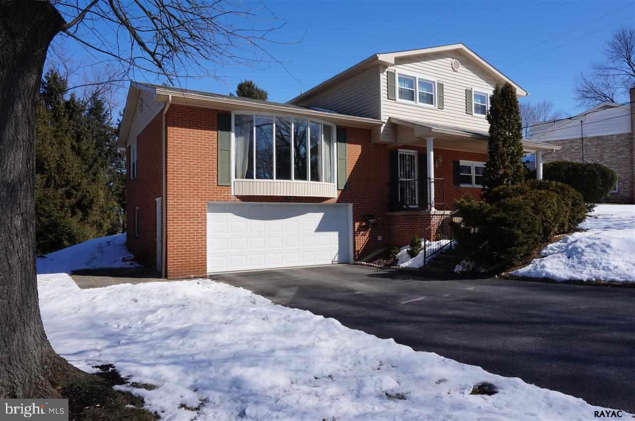 Solid built home w/luxury updates! Beautiful hdwd floors & fresh paint throughout. LR, FR, DR, EIK w/SS appl, glass tile, maple cabinets & Corian counters. 1st fl laundry, 2 FPs, lrg BRs, spa-like BA w/soaking tub & skylight, Mstr BA w/marble & travertine tile, new windows/siding/gutters, French drs, sun rm, O/S GAR, private-level lot w/nice views, mins to I83!
