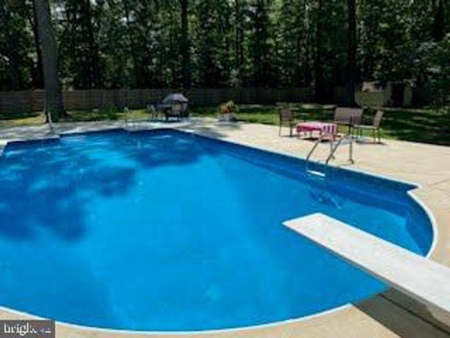 This exquisite two-level home has undergone a remarkable transformation, boasting a multitude of updates that make it the perfect family oasis. The main level features an inviting entry, it includes a convenient half bath and a laundry room. The kitchen and bathrooms have been meticulously renovated, offering modern amenities and style. You'll love the built-in features that provide a sense of unity and functionality throughout the home. New windows adorn the entire home, letting in natural light and offering energy efficiency. Brand new water heater and garage door opener, ensuring top-notch functionality. Plantation shutters add a touch of elegance and privacy to the home. A fresh powder room adds a contemporary touch to the interior. The office/room is thoughtfully equipped with built-ins, making it an ideal workspace. The hall bath has been expanded to include double sinks and a relaxing soaking tub. The smaller bedroom features built-ins, maximizing space and functionality.
The primary bedroom is a statement in red, with plenty of built-ins for storage, while the primary bath has been transformed with beautiful tile work. The family room, complete with a wood-burning fireplace, invites cozy gatherings, and the chimney is ready for inspection. A wet bar enhances the entertainment potential of the home. 

The 2-car garage is deep and offers ample storage. The crawl space has been encapsulated in February 2023, ensuring a dry and clean environment. The in-ground pool in the landscaped and fenced backyard is ideal for outdoor gatherings and entertainment. The house is constructed entirely of brick, offering timeless charm and durability. New doors enhance security and aesthetics. The property exudes curb appeal, making a lasting first impression. The expanded driveway can accommodate up to 6 cars. The yard has been thoughtfully pushed back and trees removed, allowing for a more spacious and open feel. The sale includes all lawn and garden equipment, as well as pool furniture and equipment, making this property a complete package.
In summary, this home is a perfect blend of modern updates, classic charm, and thoughtful functionality, making it a true gem in the real estate market. Don't miss the opportunity to make this your dream home.