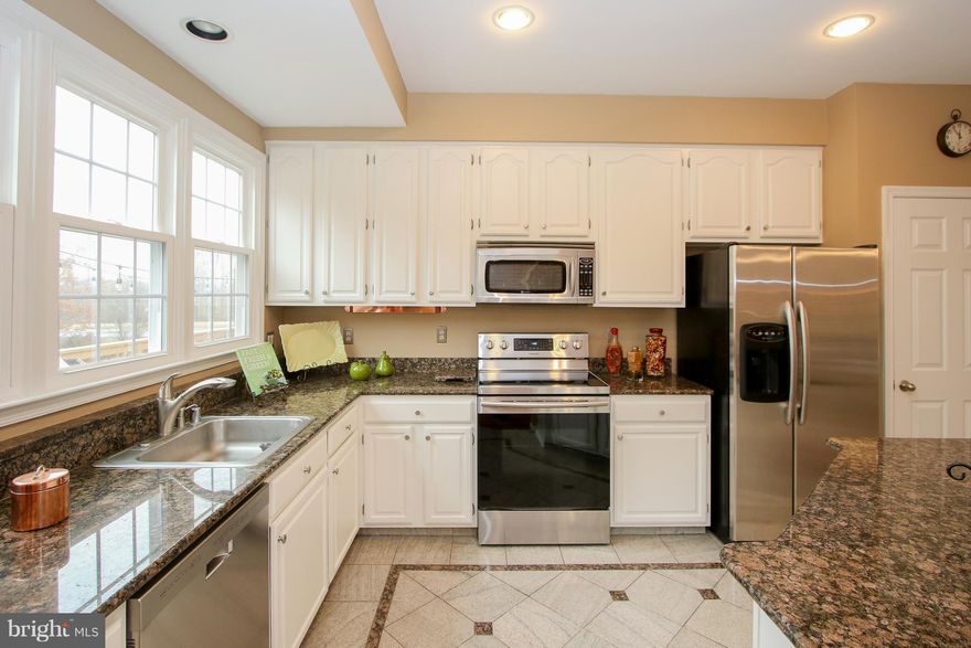 This T home is Not only located on a premium lot  backing to parkland ,Its also renovated n updated on every floor.Open FLR plan, Updated Kitchen New windows, Brand new siding ,Newer roof ,Newer AC,New  woof n tile floors ,new paint, new doors, Brand new carpet- 2 renovated baths .plus updated Master bath. lower level 4th bdrm w fireplace an walkout to Fenced yard w  New fence - the list goes on