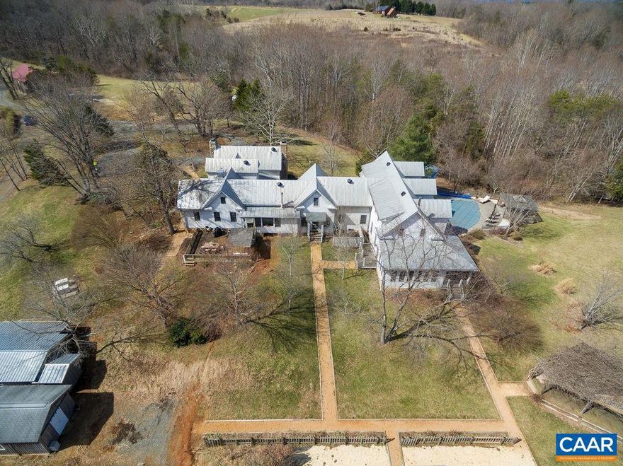 Privacy, mountain views and long river frontage set the stage for this impressive residence.  A meticulously restored colonial era home was enlarged with a custom 7,000+ SQ FT addition creating a one-of-a-kind offering, perfect as a main residence, family retreat or inn.  Examples of fine materials and craftsmanship are evident at every turn- reclaimed wood, beautiful millwork, 5, wood-burning fireplaces and beautifully designed rooms that take advantage of the historic character of the old section and the views and natural beauty of the Blue Ridge mountains and the farm.  Additional improvements include a completely restored 150-year old bank barn, swimming pool, guest cottage, whole house generator, efficient HVAC system and brand new 5 stall stable with European-style stall fronts and fencing.  The property offers significant income potential with the large home that can also function as an inn, cabin beautifully suited for an air b&b and a historic bank barn that serves as a perfect event space.,Stainless Steel Counter,Wood Cabinets,Fireplace in Dining Room,Fireplace in Great Room,Fireplace in Living Room