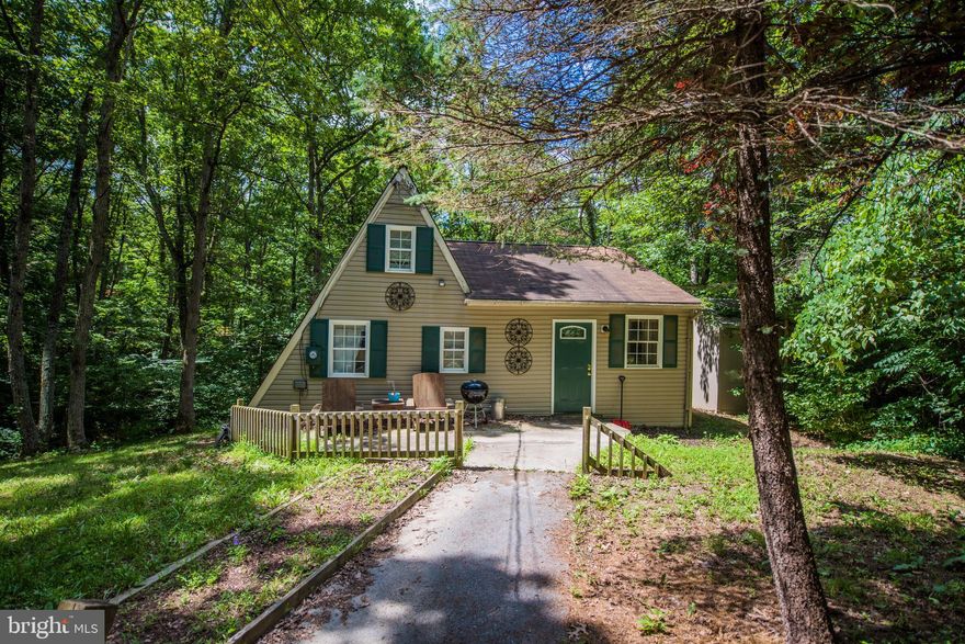 Too cute...own cheaper than renting. Your own private oasis with easy access to I81, Martinsburg & Winchester.  Wooded lot offers privacy and wildlife. Nicely landscaped and cute as can be. Lots of recent upgrades including flooring. Upper level loft for 3nd bedroom. You can not rent for this price.  The flowing floor plan offers more than the pictures show. You have got to see this one.