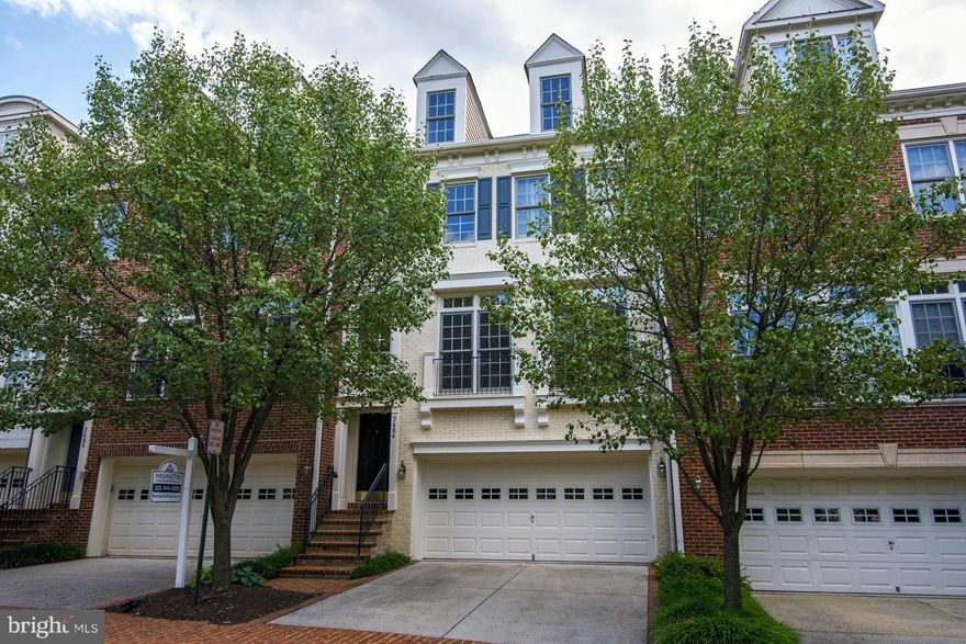 ALL BRICK TH ON BACK ROW BACKING TO WOODED SETTING  - CLOSE TO SILVER LINE METRO, TYSONS CORNER AND ALL ROADS LEADING TO  DC AND MD - ONE OF LARGEST MODELS WITH TOP FLOOR BALCONY.  WOOD AND NEW CARPET - FRESHLY PAINTED READY FOR MOVE-IN!  KITCHEN OPENS TO FAMILY ROOM AND BALCONY.  FAMILY ROOM WITH FIREPLACE OPENS TO PATIO AND FENCED GARDEN AREA - TWO CAR GARAGE