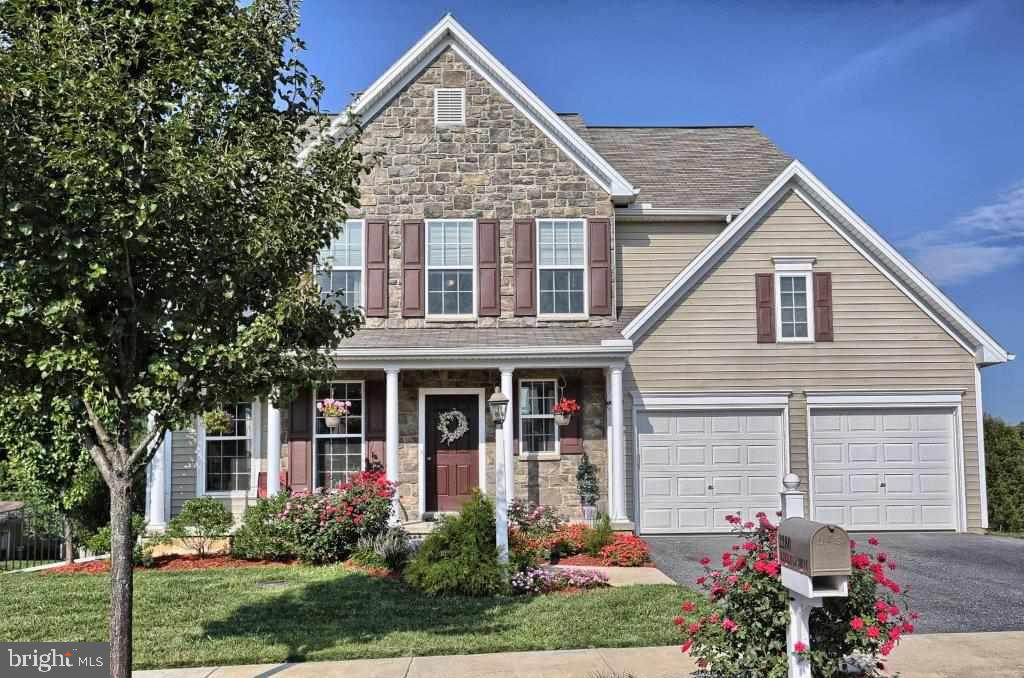 Magnificent 2 story home offers spacious Kit w/hardwood flrs, granite island, double oven & gas range. Enjoy your morning coffee in the morning/breakfast room overlooking a nice size fenced rear yard. Family room boasts a wall of windows  w/gas fireplace. 1st floor laundry, 2nd floor bonus room & LL bedroom w/full bath & ceramic tile floor, lg storage area, an in-law apartment & addl' finished room for a den, playroom or fitness room! Exposed walkout LL leading to a stone patio. Hot water on demand.
