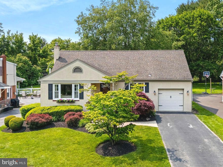 Welcome home! This fabulous “cream puff” is totally updated with undeniable “curb appeal” and a sensational backyard “oasis” just waiting for the next homeowner’s enjoyment! You don’t want to miss this opportunity to live in a truly wonderful home with all the desirable updates in an unbeatable location walkable to Woodland Elementary School, Mascaro Park, and in proximity to 422 & 202, shopping, restaurants, KOP, and Providence Town Center! Blue Ribbon Methacton schools to boot! Admire the lovely landscaping and winding stamped concrete walkway as you near the covered front porch … This is just a taste to prepare you for the magnificent storybook setting that awaits on the other side! The interior is full of updates and amenities with a functional layout for everyday living and entertaining too! The Entrance Foyer and Living Room boast beautiful hardwood floors that also span the rear hall and first floor bedroom as well as crown mouldings, tons of natural light with a large picture window and two additional windows! The Kitchen is nicely updated with 42” cabinets capped with crown mouldings, granite countertops, all stainless steel appliances, ceramic tile flooring and backsplash, complete with recessed and under cabinet lighting! The Kitchen flows into the Dining Room and also conveniently accesses the Basement level as well as the attached Garage! The Dining Room is spacious with ceramic tile flooring, a tasteful lighting fixture, crown mouldings, and a wall sized sliding glass door to the backyard retreat! Take a peak to be “Wowed”! This level is complete with a Rear Hall with a coat closet, full Bathroom with a tub/shower combination and vessel bowl sink, and a first floor Bedroom that could be used as an Office or even an In-Law Suite! The Second Floor features a sprawling Primary Bedroom Suite with vaulted ceilings, a spacious walk-in closet, sitting area(s), and an attached updated Primary Bathroom. This Bath has floor-to-ceiling cabinetry, double sinks, heated tile flooring, a large walk-in shower, and a separate commode area! The open Hall leads back to an additional large Bedroom with vaulted ceilings and a Juliet Balcony that overlooks the stunning rear grounds! A large walk-in closet is adjacent to this bedroom. The Basement is full and unfinished with more than ample storage space, including the Laundry Area, and is plumbed for a future bath! The attached Garage looks like additional living space with an epoxy floor and finished storage area in the rear that access the Rear Grounds! The tranquil setting in the backyard offers a sense of complete contentment, leaving you with nothing left to want! There is beautiful oversized stamped concrete and brick terrace/patio that flows length of the house, wonderful for outdoor dining and entertaining, a Koi Pond with waterfall, lovely landscaping all around the perimeter with a large fully fenced in lush yard, tiered fire-pit/theatre area with Pergola in the rear as well as a Storage Shed! You don’t want to miss the sunset from this fabulous outdoor retreat! Don’t wait to come see this beauty TODAY! (The street will be repaved starting Monday! So hurry up!)