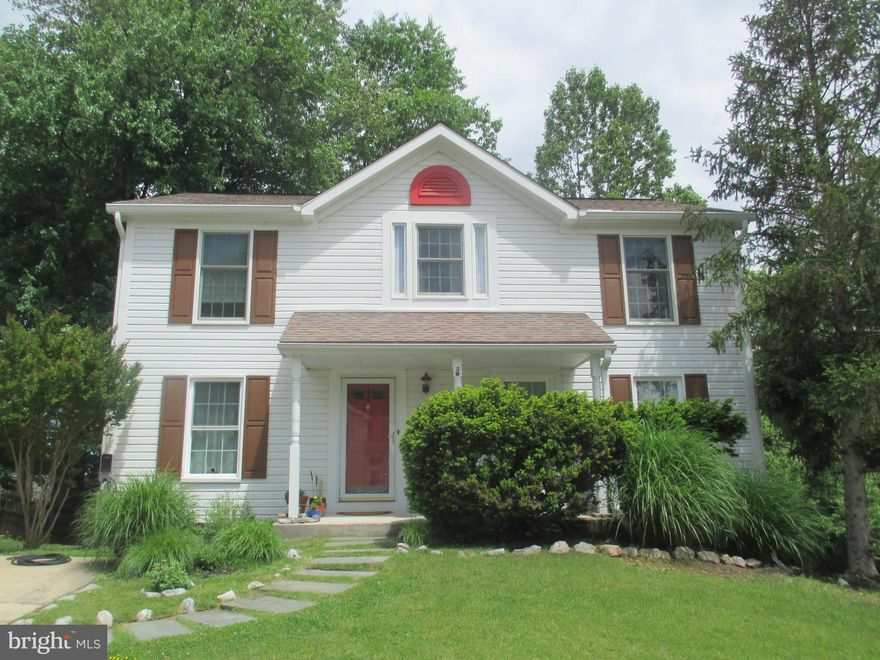 Welcome Home!! This is a Must See!! Beautiful Colonial on a Well Maintained, Corner Lot with Lots of Trees!! Enter the Home Through the Foyer that Opens into the Newly Carpeted Spacious Living Room.  The Separate Dining Room off the Foyer opens into the Kitchen. The Kitchen Features Ceiling Fan, Beautiful Hardwood Floors, Built-In Desk and Breakfast Area. Powder Room is Located Off the Breakfast Area with Vanity and Porcelain Tile Flooring. Walk thru the Breakfast Area into the Cozy Family Room with New Carpet, Ceiling Fan, Wood Burning Fireplace and Slider to Spacious Rear Deck. Access to the Spacious Unfinished Lower Level is Off the Breakfast Area. The Second Floor Includes Primary Bedroom with Walk-In Closet, Cathedral Ceiling, Decorative Half Round Window, New Carpet and Ceiling Fan. Primary Bathroom has Walk-In Shower with Porcelain Tile Shower Surround, Double Sink Vanity, Linen Closet and New Porcelain Tile Flooring.  Second Bedroom has Ceiling Fan and New Carpet, Third Bedroom has Walk-In Closet New Carpet and Ceiling Fan, Fourth Bedroom has New Carpet, Ceiling Fan and Could be used as a Nursery with Additional Access to Primary Bedroom. Full Hall Bathroom with Tub/Shower Porcelain Tile Surround, Double Sink Vanity and Porcelain Tile Flooring. Laundry Room is also Located on the Second Floor with Newer Washer and Dryer. All New Windows. This Home also Includes an Electric Car Charging Outlet Located Near the Driveway. No HOA