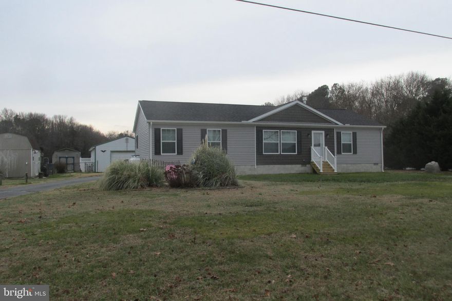 Beautiful never lived in rancher situated on 1.3 acres of land. 24x48 pole barn with electric, water, and heat with a large storage container connected. Everything is new and ready for you to enjoy this rural country setting. Just a few miles to the beach, rt-1, and shopping. Beautiful landscaping with stone beds, pool, fire pit all in your own back yard. It is a Two-bedroom two full bath home with large office study room additional two the bedrooms.   Schedule your appointment today!!!!