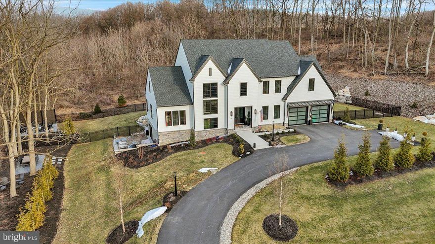 Step into luxury with this beautifully crafted residence offering 5 BR, 4.5 BA and a spacious 2-car garage. Designed with both elegance and functionality in mind, this home boasts thoughtful details and high-end finishes throughout. Built by Pine Hill Building Co. in 2023, this property is nestled on 1.66 acres and offers a fenced-in yard that backs up to a serene, wooded area, providing both privacy and a picturesque backdrop. 

On the first floor, you'll be welcomed with a sleek metal staircase, gorgeous upgraded light fixtures throughout, an inviting family room with a striking tile fireplace. The gourmet kitchen is easy to love with its 10' island, scullery and large walk-in pantry. An entry level guest suite provides a private retreat, while the home office ensures a quiet space for productivity. A drop zone inside the garage, offers 2 coat closets and cubbies to add additional convenience for busy households. 

Upstairs, 9-foot ceilings enhance the sense of space. The primary suite is a true sanctuary featuring a fabulous walk-in shower, heated floors and other luxurious finishes. A secondary bedroom suite plus a Jack and Jill bedroom/ bath set up all offer ample closet space. There is an additional flex room perfect as a second office, playroom, exercise room which offers incredible versatility.

The full walk-out basement is home to 1900 unfinished square feet that is waiting for you to put your finishing touches on.

Every aspect of this home exudes luxury and sophistication, with high-end finishes that elevate its elegance and timeless appeal. Don't miss the opportunity to make this extraordinary home yours! Contact me today for your private showing.