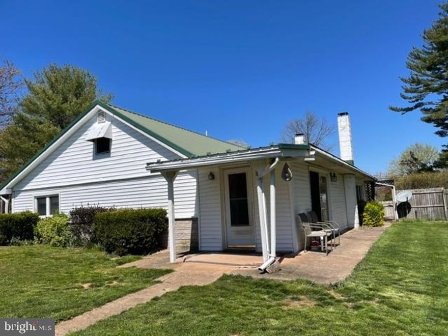 Rancher on .82 acres, Private Setting,  Fenced in yard, 3 Car Detached Garage to the rear has Workshop and Storage, 2 Wood Stoves, 3 Bedrooms, Eat-in-Kitchen with  Breakfast Bar, Living Room, Sunporch and Sunroom, Full Bath, Plumbed for 1/2 Bath in Laundry Room, Crawl Space off Sunroom, Laundry Room on main floor.  Cozy house in semi-private setting.