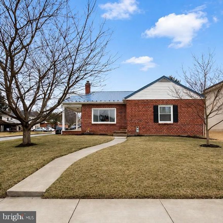 Welcome to this adorable all-brick rancher set on a charming 0.17-acre corner lot, offering timeless character, solid construction, and incredible potential. Built in 1952, this home showcases the craftsmanship of its era with beautiful hardwood floors, classic arched doorways, and bright, inviting living spaces throughout. The sun-filled living room is warm and welcoming, highlighted by large windows, a cozy fireplace with insert, and a door leading out to the charming side porch—perfect for relaxing with a morning coffee or unwinding at the end of the day. Just beyond is the dining room and absolutely charming kitchen, creating a comfortable layout for everyday living and gathering. The home offers three generously sized bedrooms and one full bath. Storage and future possibilities abound with a walk-up attic providing excellent storage space, while the spacious basement features a partially finished rec room area, laundry and utility space, plumbing for a future bathroom, and a walkout exit. With its size and layout, the lower level offers the potential to nearly double the home’s living space. Replacement windows, a newer gas furnace (July 2023) and a metal roof offer peace of mind for some of the home’s major updates. Outside, the property continues to impress with a detached two-car brick garage with newer garage doors, a charming side porch, and a covered rear porch overlooking the yard. All of this is set in a great location just minutes to shopping, dining, schools, and interstate access. Homes with this much charm, character, and opportunity rarely come along—this is one you won’t want to miss.