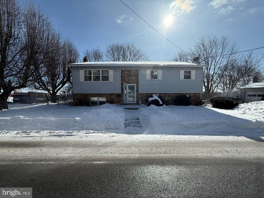 Well-maintained bi-level home offering 3 bedrooms and 1.5 bathrooms, with a functional layout and great additional space. The lower-level family room has been redone, providing a comfortable area for relaxing or entertaining. The downstairs half bath has also been updated, while the upstairs bath offers an opportunity for future customization.  The home features a 200-amp electrical service, with plumbing and electrical systems in good condition. The roof was replaced approximately 10 years ago. Flooring throughout includes carpeting, with some areas replaced within the last several years.  Heating is provided by an oil furnace, with the added benefit of a coal stove for supplemental heat. The kitchen has not been updated, allowing the next owner to design it to their taste.  Outside, the property includes an oversized 2-car garage/pole building measuring approximately 32’ x 28’, featuring drywall, a concrete floor, and two garage doors—ideal for vehicles, storage, or a workshop. The home is serviced by public water and public sewer.
A solid property with great potential, ample garage space, and key updates already completed.