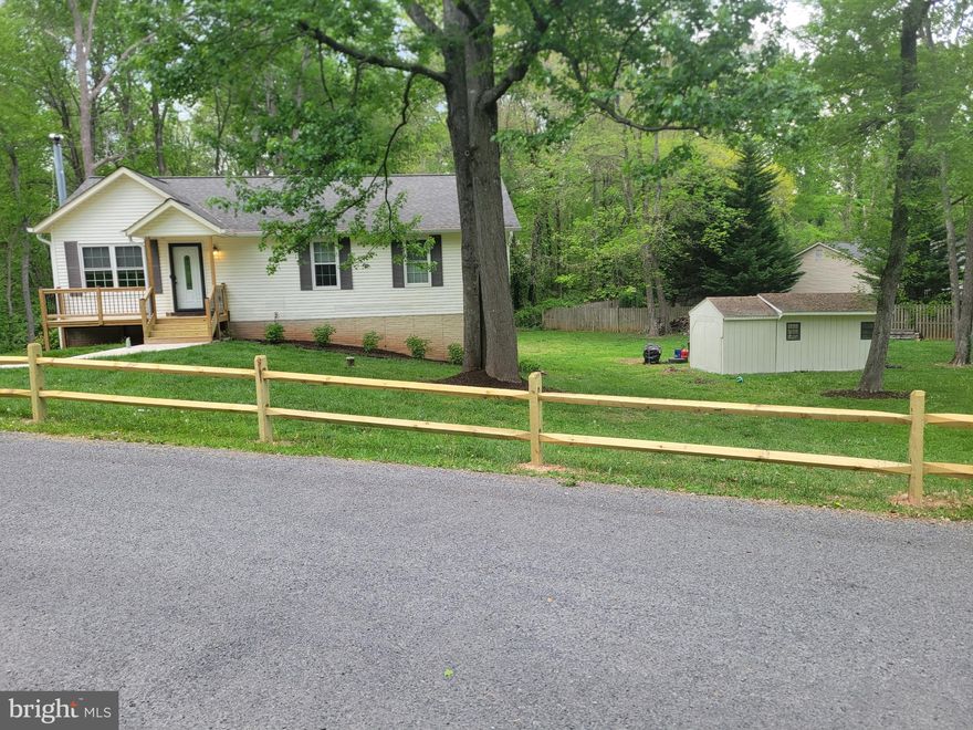 Welcome to this meticulously maintained 3-bedroom, 3-bath home nestled in the warm and  established Lake Jackson neighborhood known for its long-time residents and strong sense of community. Located at the end of a rural road with a very low volume of traffic you will be conveniently situated near major commuter routes, top-rated hospitals, shopping centers, restaurants, and a variety of recreational amenities including access to Lake Jackson!  Offering both comfort and convenience, this ideal location will satisfy all of your needs without worrying about an HOA!  A long list of updates and upgrades build upon a foundation that this home provides satisfying your desire for modern conveniences and needs.  Inside, you’ll find a spacious layout flooded with natural light, featuring generously sized bedrooms, three full bathrooms, and a welcoming living area perfect for entertaining or relaxing. The kitchen is well-appointed with modern appliances and ample storage, flowing seamlessly into the dining area and family room.  The recently remodeled den in the basement, including a wood burning stove, is a great place for a theatre room, man cave, or whatever your heart desires.  Outside, the yard offers space to unwind, garden, throw a ball with your pets, or host gatherings—all within a tranquil setting.  Sip morning coffee or enjoy afternoon beverages on the front porch or back deck and absorb the peace offered or marvel at the wildlife harmlessly passing by. Enjoy peace of mind with thoughtful updates and pride of ownership evident throughout. With 1,375 square feet of very functional living space finished and 914 square feet ready for expansion, this residence can accommodate growing families, retirees looking to downsize, and all needs in between. Whether you're commuting to work, running errands, or enjoying a night out, everything you need is just minutes away. This is more than a house—it's a place to truly feel at home.  Let’s get you home to 8973 Round Top Rd. Manassas, VA!