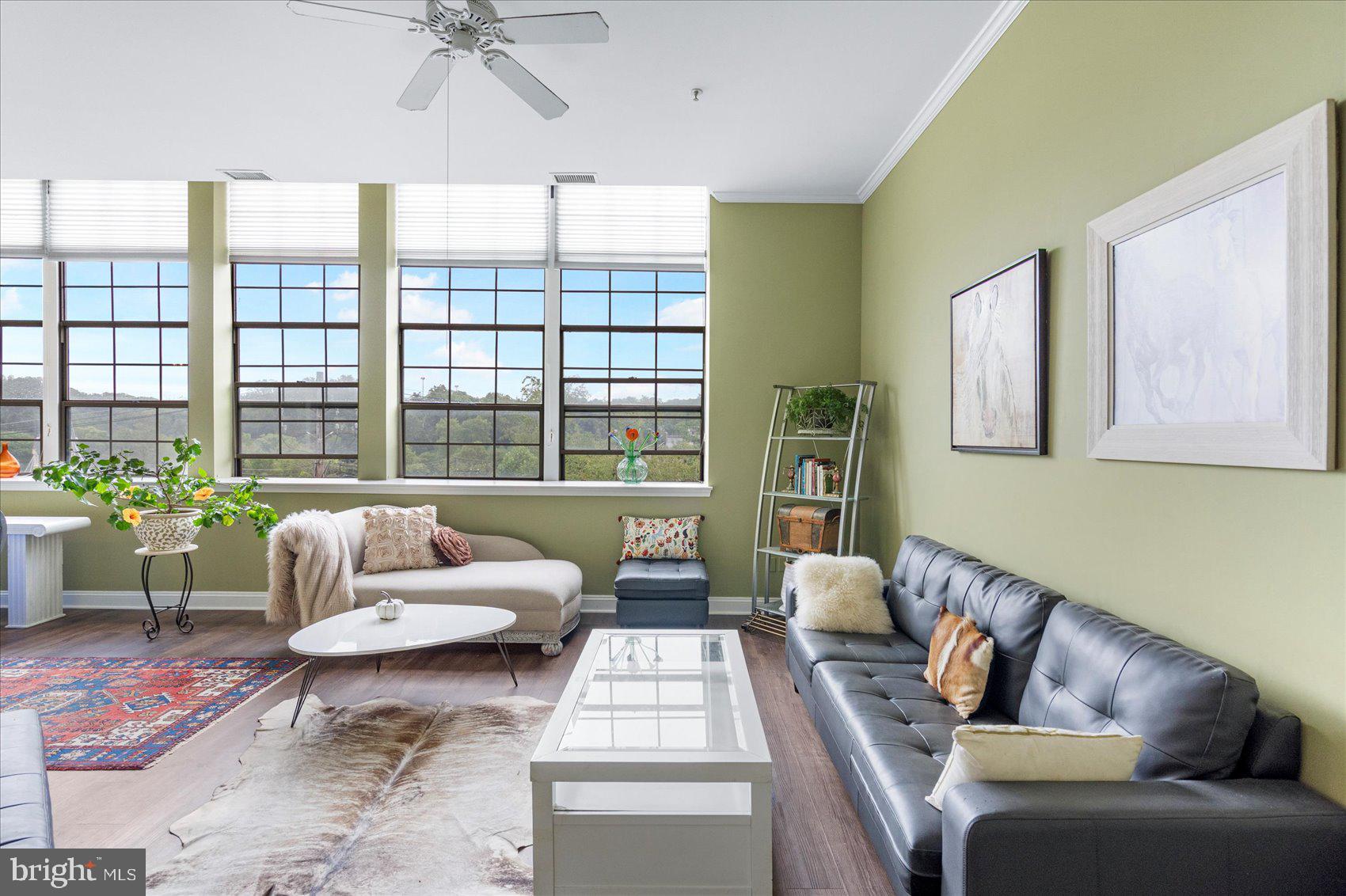 Experience the perfect blend of modern industrial design and cozy charm in this one-of-a-kind condo, ideally located in Historic Ellicott City. Featuring high ceilings, oversized paneled windows, and an abundance of natural light, this home offers stunning views of nearby cathedrals and treetops.
The open-concept living space is warm and inviting with a gas fireplace and unique architectural details throughout. The sleek kitchen and living areas are ideal for entertaining or quiet evenings at home.
The spacious primary suite includes a luxurious bathroom with a double vanity, soaking tub, and walk-in shower. A second bedroom and full bath provide flexibility for guests, a home office, or additional living space.
This truly special home combines historic charm with modern amenities, steps away from the shops & restaurants of Main street Ellicott City, Saturday morning Farmer's Market, the Trolly Trail, local street fairs and festivals, and so much more- don't miss the chance to make it yours.
Notable Updates: New Hot Water Heater, New Garbage Disposal