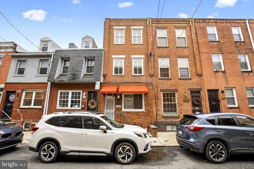 Great new listing on a quiet block in the Passyunk Square area!


Beautiful three-bedroom plus den, two-and-a-half-bath home featuring solid oak hardwood floors throughout and great natural light. Enter into a spacious living room with large bay window and custom plantation shutters. Straight stairs lead to a generous dining room with custom built-in pantry towers and display cabinets, creating a perfect transition into the kitchen.



The kitchen offers excellent cabinet space, granite countertops, tile backsplash, and a convenient side powder room. Just beyond is a nice outdoor space—perfect for relaxing or entertaining.


The second floor features two comfortable bedrooms, including a bright front bedroom with hardwood floors, custom shutters, and detailed woodwork, along with a rear bedroom with a large closet. A full tile bath completes this level.



The third floor offers a light-filled front bedroom with hardwood floors and an additional den/sitting room, leading to another full bath with walk-in shower.



The basement houses the mechanicals and provides additional storage along with a washer and dryer.



Located in a great area convenient to many cafes, sandwich shops, and other locally owned small businesses. Easy to show!