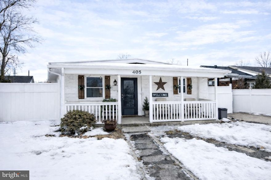 This 3-bedroom, 1-bath ranch-style detached home offers comfortable single-level living with thoughtful indoor and outdoor features.  A welcoming covered front porch greets you upon arrival. Inside, the home opens to a bright living and dining area with an easy-flow layout. The kitchen is equipped with a center island, pendant lighting, double sink, ceramic tile flooring, and access to the laundry area with washer and dryer.  The full bathroom includes ceramic tile flooring and a tub/shower combination. Two secondary bedrooms are located along the hallway, while the primary bedroom (currently utilized as a family room - door will be reinstalled prior to settlement) is privately positioned at the rear of the home. This space features carpet flooring, a walk-in closet currently utilized for flexible storage/workspace, and double French doors leading to the covered back porch.  Enjoy outdoor living in the fenced backyard, complete with a detached outbuilding ideal for hobbies, recreation, or bonus use. The kitchen’s side exterior door leads to the concrete carport, which also provides backyard access.  Pride of ownership is evident throughout.  This home is ready for it's next owner.  Sale contingent upon sellers finding suitable replacement housing.