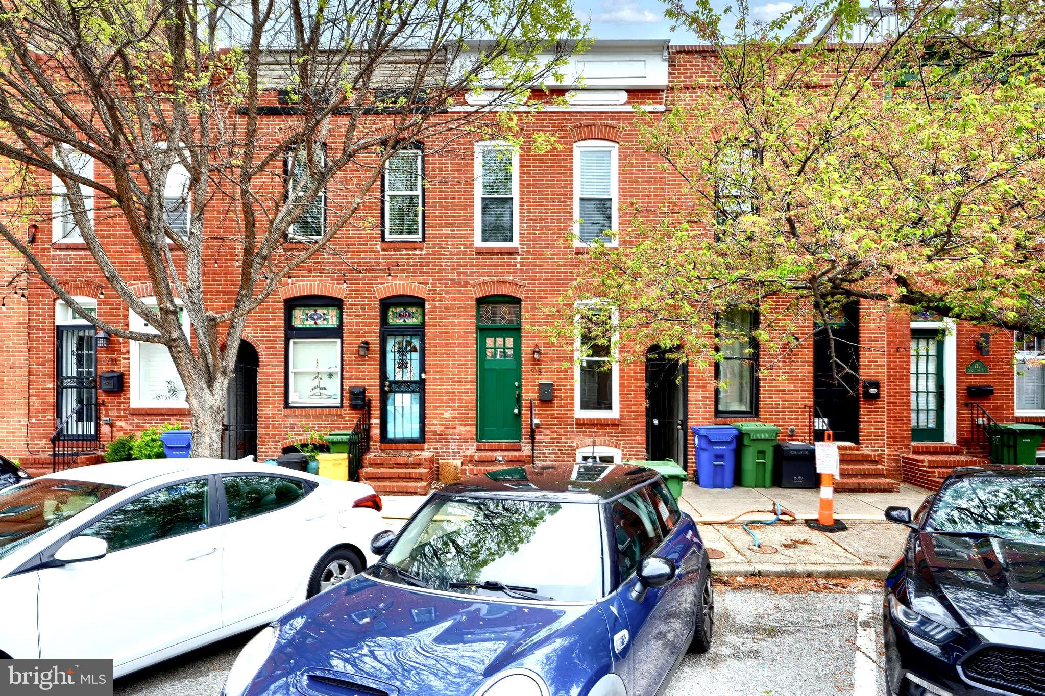 Updated, light and bright row home in the heart of Canton! Clean, contemporary finishes throughout the house, with beautiful hardwood floors, and exposed brick walls. The first floor boasts a white gourmet kitchen, open concept living room and 1/2 bath. The second floor features two bedrooms, each with their own full en suite bathroom. The basement is also renovated with a full bathroom, perfect for an entertaining/movie room! Ideal for outdoor entertaining, this house has a private, fenced patio off the kitchen that is raised 8 feet above the alley for additional privacy, as well as an inviting rooftop deck! Being steps from Canton Square, the waterfront, and more, the location can't be beat.