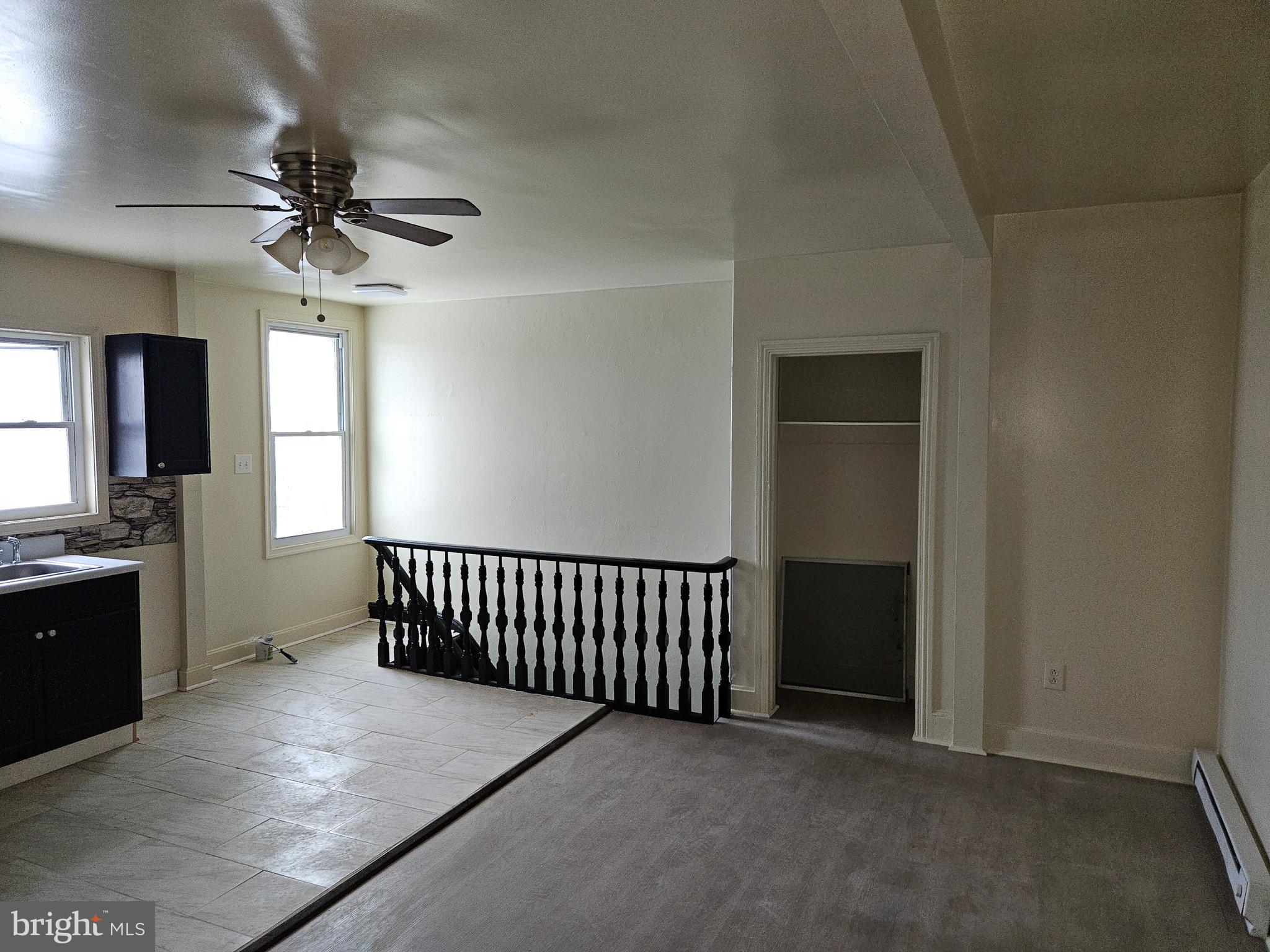 This is a third-floor apartment with two spacious bedrooms with plenty of closet space, tile flooring, refrigerator, stove, ceiling fans, located in the center of stores and schools.