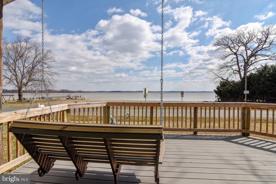 Talk about location! This home in the desirable Featherstone Shores Community offers one-level living and breath-taking unobstructed panoramic water views of the Belmont Bay/Potomac River and National Wildlife Refuge.   Enjoy the quiet and peace of this waterfront community with private park featuring amenities that include beach, picnic areas, shared dock, fishing, playgrounds, and more.  Ospreys and Eagles are often seen soaring and fishing nearby. Enjoy kayaking, jet skiing, or drifting peacefully a few yards from your home on the bay.  Being only minutes from the VRE station, I-95, and Route 1 allows easy travel in any direction for work, or to enjoy a wide variety of shopping, dining, wineries, and entertainment venues. By the way, SUNSETS HERE ARE AMAZING.