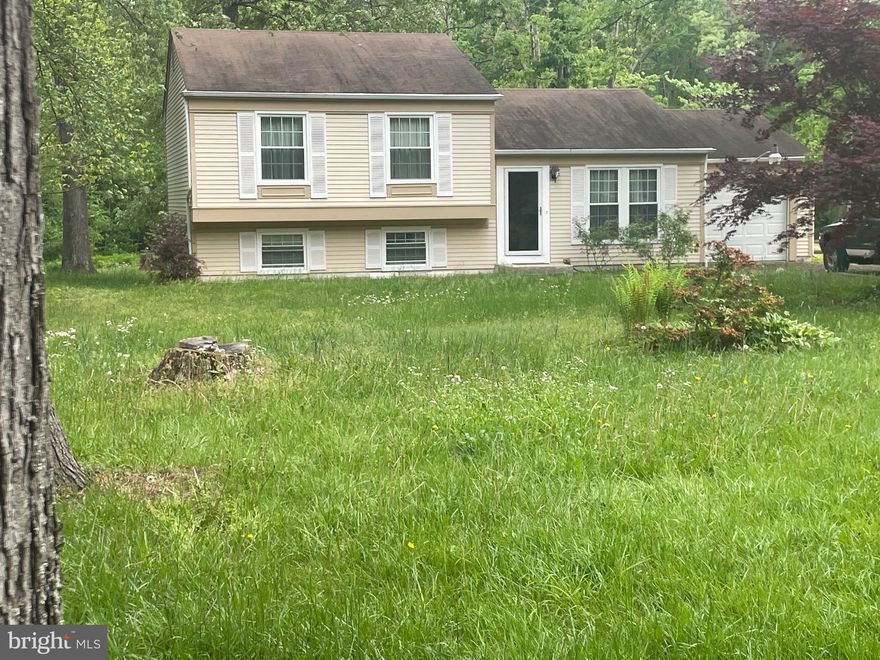 Level 1.1 acre lot with a 3 BR 1.5 BA 3 level Split with attached 1 car garage sitting on it. Off street parking for days!Home needs updating, Price reflects overall condition but quite habitable now.  (would pass FHAB financing) Perfect for thr handy buyer that wants live in & work on their house. Exterior just Pressure washed, Paquet hardwood Kitchen floor just refinished. Home would most lokely pass FHA203B, but conveys as-is.  Screen porch & open deck in rear. Stoprage shed. Seller says all plumbing in the house has been replaced. All electric house. Best financing would be Conventional, FHA203K. Check the comps to see what this place could if renovated.