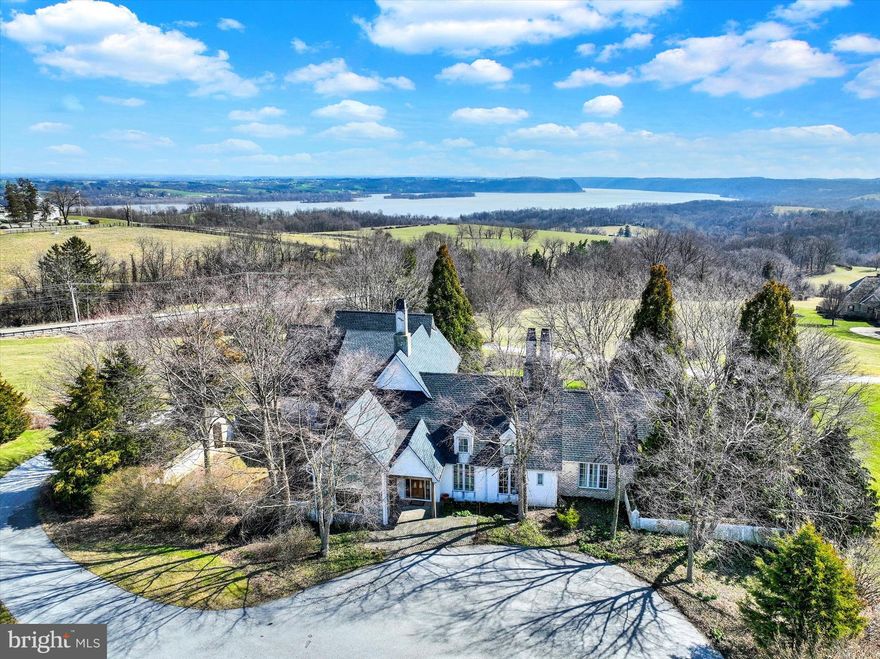 Welcome to your very own serene countryside retreat at 1255 Trinity Church Rd, Wrightsville! Nestled amidst picturesque landscapes, this charming property offers the perfect blend of tranquility and convenience.
Step inside this beautiful home to discover spacious interiors flooded with natural light. Boasting 4 bedrooms and 2 full & 2 half bathrooms, including a sizable primary bedroom on the main level that has two walk-in closets. The second bedroom on the main level can also be used as a study or craft room. This residence provides ample room for comfortable living yet has a cozy feel. The heart of this home, is a Keener custom built kitchen which has ample cabinetry, and a center island, perfect for culinary enthusiasts. Adjacent to the kitchen is a large butler's pantry and access to your side covered patio and a fenced in Courtyard. Outside, you'll find a sprawling yard surrounded by lush greenery, providing the perfect backdrop for outdoor gatherings and recreational activities. Whether you're hosting a barbecue or simply enjoying the tranquility of nature, this expansive outdoor space which is just under 17 acres of land offers endless possibilities. The rear covered deck gives you breath taking views of the Susquehanna River. Additionally, the property is within close proximity to major transportation routes such as Route 30. This home also has a whole house generator that uses propane and two zone geothermal heating. New roof August 2022 and new alarm system August 2023. Don't miss the opportunity to make this your dream home!