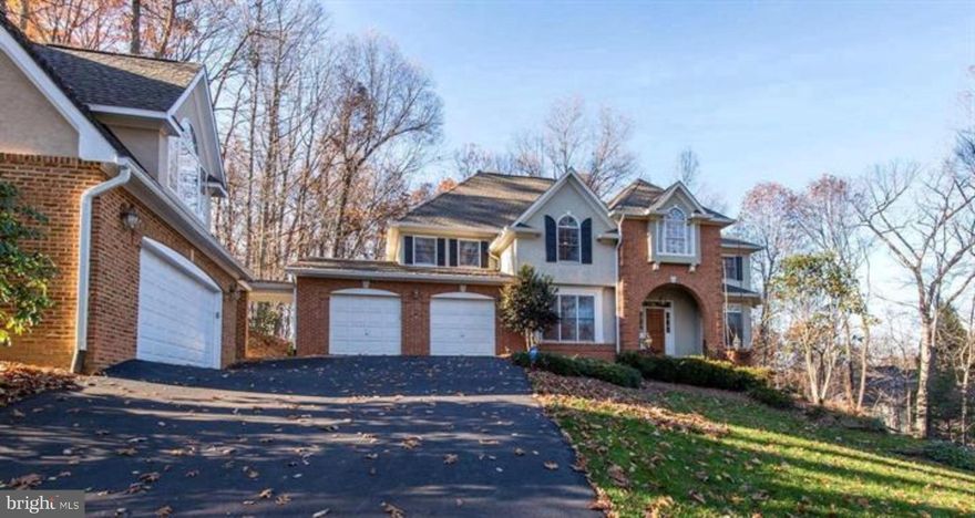 Motivated Seller. This beautifully maintained, custom-built home has it all—over 5,000 sq ft of living space, tons of upgrades, amazing privacy, and some of the best views around! Tucked away on a quiet, tree-lined lot that backs to woods, this home offers a peaceful retreat while still being just minutes from Reston, Tysons, DC, the Metro, and the airport. You’ll love the open floor plan with 4 bedrooms, 3 full baths, and 2 half baths, plus a 5-car garage. There’s even a separate studio/loft space above the garage with its own entrance and a half bath—perfect for a home office, guest suite, creative studio. The main level features hardwood floors, arched entryways, crown molding, and tons of natural light. The two-story family room with cathedral ceilings, skylights, and a stone wood-burning fireplace is a total showstopper. There’s also a cozy second fireplace in the formal living room, plus a formal dining room that’s great for entertaining. The gourmet kitchen includes granite countertops, stainless steel appliances, a double oven, a sunny breakfast nook, and access to a large deck overlooking the private backyard. A dual staircase (one from the main foyer and one from the kitchen) adds a nice touch of elegance and convenience. Upstairs, you’ll find 4 spacious bedrooms, including a primary suite with his-and-hers walk-in closets. The basement is fully finished with a large rec-room, full bath, and a walkout to a fenced-in yard and patio—great for relaxing or entertaining. Prime location’ close to everything, shops, restaurants, parks, the Metro, and major commuter routes—yet you still get to enjoy the peace and quiet of a private, wooded lot.