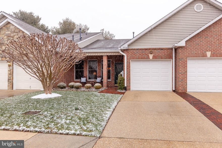 Welcome to the Villas at Ballast Way,  a unique and special enclave in amenity rich Heritage Harbour.  This pristinely maintained home offers a spacious open living/dining area with gleaming hardwood floors throughout.  The kitchen has been updated with granite countertops and stainless steel appliances and there is plenty of cabinet space along with table space for casual dining.  There is a user friendly laundry room off of the kitchen with additional storage space.  The primary bedroom has a walk-in closet and ensuite bath.  The 2nd bedroom has a wall of custom built bookshelves.  The cozy den has a fireplace and access to the back patio and yard.  There is an attached one car garage with storage space and numerous guest parking spots available in the Ballast Way community.  Heritage Harbour is well known for its' exceptional amenities that include beautifully landscaped common grounds, community center with activities that range from exercise rooms,  indoor/outdoor pools, tennis/ pickle ball courts to billiards, library and meeting rooms.  Golf memberships are also available and there is a dock and pier for water access.  There is something for everyone.  All buyers in Heritage Harbour pay a one time recreation fee of $2,075.