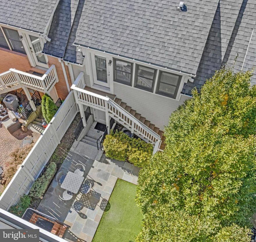 ***SELLER TO REVIEW ALL OFFERS BY/BEFORE 6 PM ON MONDAY 3/9*** Looking for outdoor space with a yard?! This home has it all and more! Rear fenced in yard,  2 balconies, and a full rooftop deck terrace!! 
Welcome to 2102 Main Line Blvd, an exceptional executive-style townhome in one of Alexandria’s most sought-after communities — Potomac Yard. This 5-bedroom, 4.5-bath home offers luxurious living space with a rare detached carriage house featuring a 2-car garage and private studio suite above, all connected by a fully fenced courtyard — a layout seldom available in this neighborhood.
Step inside to discover 10-foot ceilings on the main level and 9-foot ceilings throughout, giving every space an open, airy sophistication. The open-concept main level is ideal for entertaining, featuring hardwood floors, updated finishes, and a gourmet kitchen that flows seamlessly to the outdoor patio. Upstairs, brand-new carpet refreshes the bedrooms for a move-in-ready feel.
The primary suite impresses with its 19' x 12' dimensions, two custom closets, and a spa-inspired en suite bath with dual vanities, frameless glass shower with bench, and abundant storage. Two private balconies extend your retreat outdoors off the Primary!  The adjacent bedroom makes a perfect office, nursery, or fitness space, while the third floor boasts two additional bedrooms, a full bath, laundry room nestled between the bedrooms and the  sun-drenched family room.
Head to the fourth floor for a 19' x 9' recreation room  that opens to a stunning rooftop terrace — the ultimate space for entertaining or unwinding both inside and under the stars.
Super low HOA fees of $125/mo, but also unmatched walkability as well— just steps to Del Ray’s shops and restaurants, minutes to Reagan National Airport, and an easy commute to DC via the nearby Potomac Yard Metro (Blue/Yellow lines) that you can walk to! Dash Bus is FREE! 
This home checks every box — style, space, flexibility, and location. Welcome home to 2102 Main Line Blvd — where executive living meets effortless elegance.