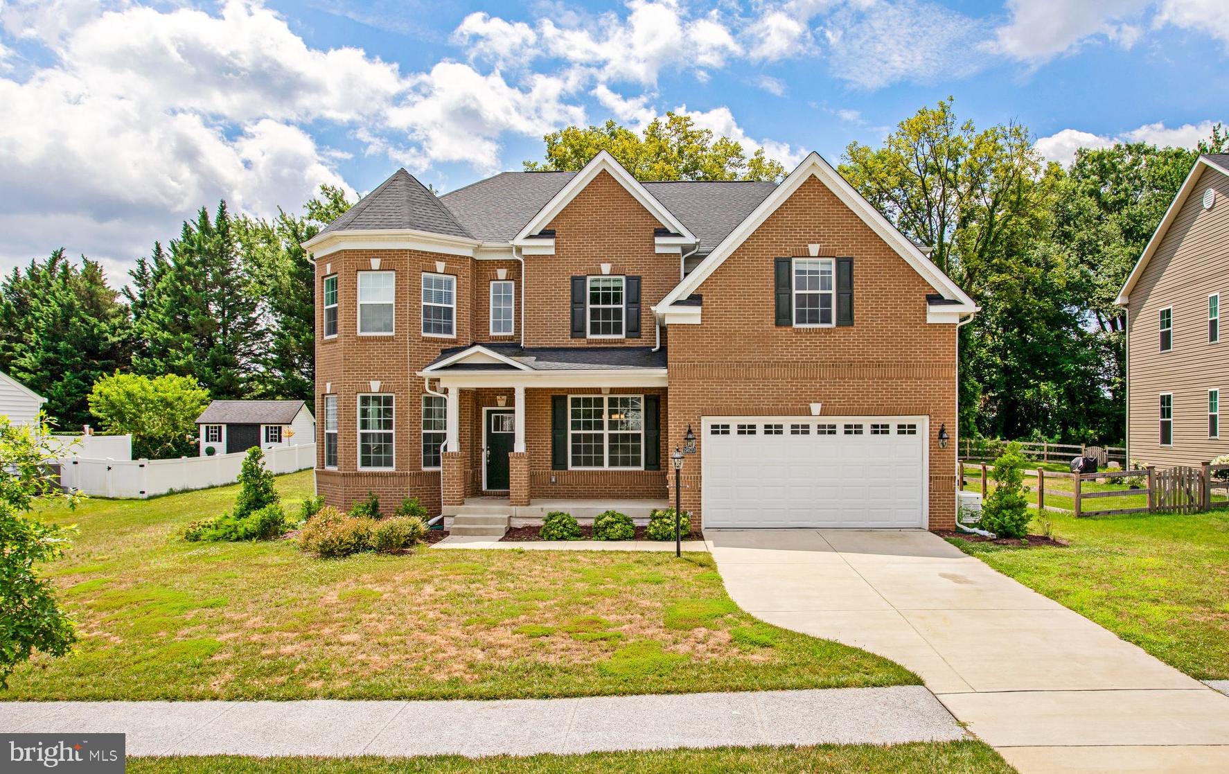 Welcome to this stunning Lennar Azalea model in sought-after Westerly Grove, Poolesville’s premier single-family community. Built in 2022, this meticulously upgraded residence offers over 5,800 sq ft of living space across three finished levels, with 6 bedrooms and 5 full bathrooms, all sited on more than a third of an acre. The open floor plan features a grand two-story great room with a modern fireplace, custom built-ins, and a wall of windows framing the beautifully landscaped, tree-lined backyard — a private oasis perfect for relaxing or entertaining, with ample space for a full-size pool. The gourmet kitchen is a chef’s dream, with an oversized island, granite countertops, stainless steel appliances, a large pantry, and a separate scullery. A main-level bedroom with a full bath offers flexibility for guests or multigenerational living. Upstairs, the spacious primary suite features a tray ceiling, generous walk-in closet, and spa-like bath with an expansive thirteen-foot shower. Three additional bedrooms, including one with an en-suite bath, plus a buddy bath and convenient laundry complete the upper level. The finished walk-up lower level offers a large rec room, media room, sixth bedroom with full bath, and is prepped for a future wet bar. A two-car garage with ample storage rounds out this exceptional home. Enjoy an unbeatable location in charming Poolesville — surrounded by open space and served by Maryland’s top-rated schools.