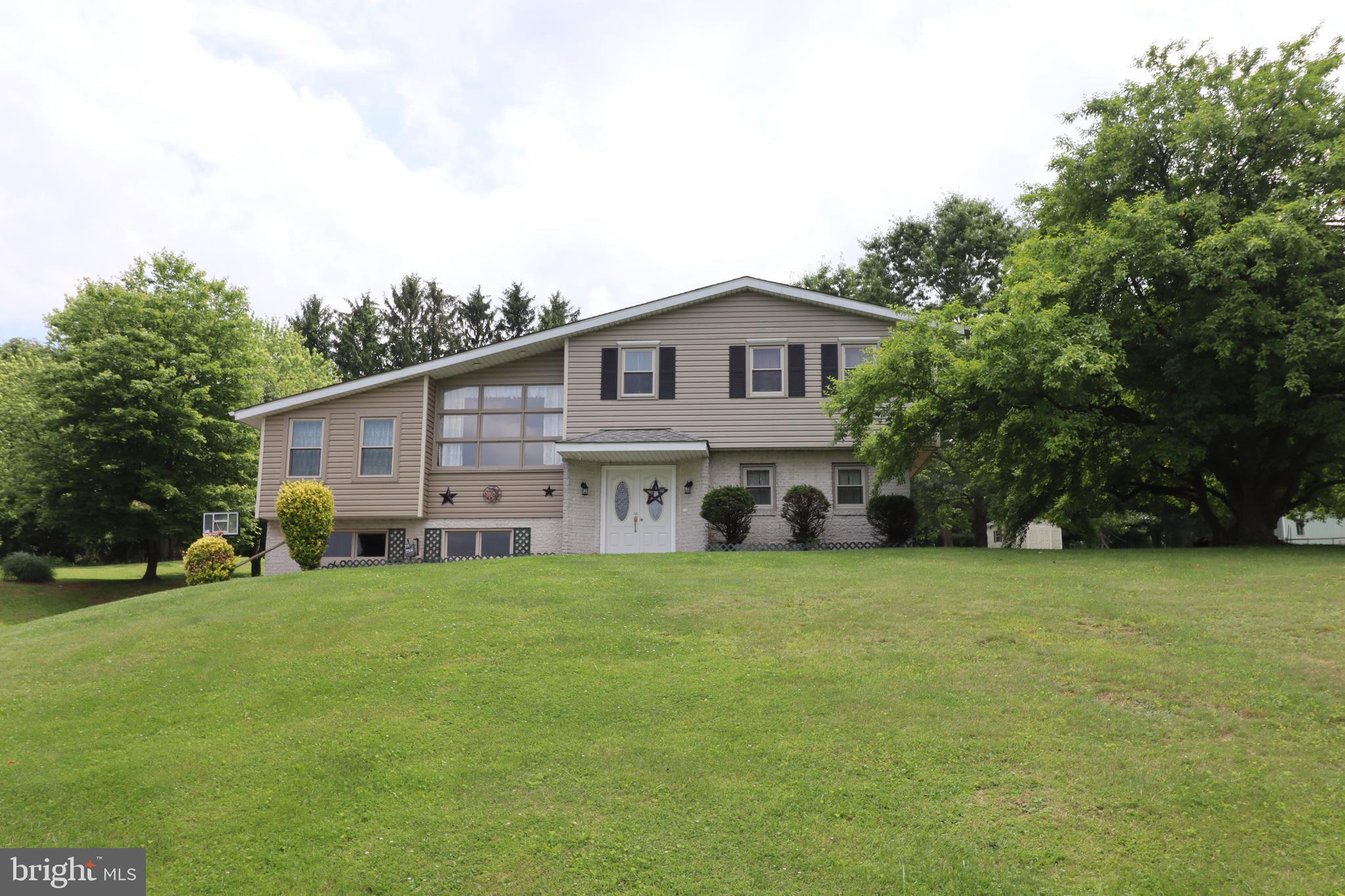 Located in a spacious and beautiful setting, this unique multi-level home is ideal for those looking for room and privacy, as there is plenty of room for everyone, inside and outside. This home includes 4 bedrooms, 2 full baths, and a huge family room, complete with a brick fireplace. Over-sized 2 car garage. Geo thermal heating!! Newer kitchen with beautiful cabinets and brand new appliances. Sit back and enjoy the view of the 1+ acre lot on the lovely covered patio. This home is perfect for those looking to be close to the MD line as it is located in South Hanover, and in South Western School District. This home is truly a RARE find, call today for a private showing.