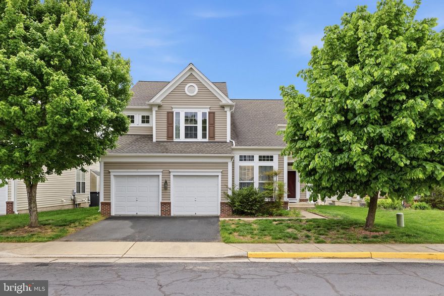 Bright and inviting home offering a spacious, open layout filled with natural light. The kitchen features granite countertops, a center island, maple cabinetry, and a sunny breakfast area, opening to a two-story family room with a gas fireplace and sunroom extension. The upper level includes three bedrooms. The primary suite features a tray ceiling, two walk-in closets, and a private bath with separate tub and shower.  The fully finished walk-up basement provides exceptional versatility, featuring a full bath, two large recreation areas ideal for entertaining, play, or exercise , and a separate enclosed bonus room - perfect for a home office, guest space, or gym- along with ample storage.
Additional highlights include a main-level library with vaulted ceiling, laundry room, and a two-car garage. Recent updates include: Roof (2022), Water Heater (2022), Dishwasher (2022), HVAC (2024), Refrigerator(2024), Washer and Dryer (2025), Fresh  paint (2025).