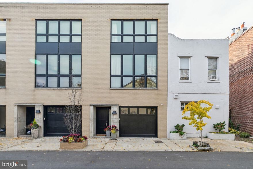 Welcome to 410 S 21st Street in Rittenhouse Square! This 20 ft wide home with a 1-car garage features high ceilings, spacious rooms, an elevator to all levels, and an enchanted garden on the main level. The first level is an entertainer's dream with a large central kitchen with black stone countertops, custom cabinetry, and professional-grade appliances all open to the dining room and living room with a gas fireplace and large glass slider to the private terrace. also on this main level is a conveniently located powder room, as well as a large coat closet. An oversized skylight from the roof lets natural light flow through a center light well. The 2nd level has an open den with floor-to-ceiling windows and an additional gas fireplace. Also on this level is the primary suite which is entered through a hall of custom closets. The bedroom and overlooks the garden and has an en-suite bathroom with a soaking tub, a separate shower stall with a glass enclosure, a toilet closet, and a double sink vanity. This suite is complete with 2 walk-in customized closets. Two additional bedrooms -- each with a walk-in closet and en-suite bathroom - are situated on the 3rd level along with a built-in home office in the main space and a large laundry room. The lower level has high ceilings with a media room, a built-in bar area, a guest room with an en-suite bathroom, and a conveniently located powder room and storage room. This ideal location places you within easy reach of diverse dining and retail as well as easy access to Schuylkill River and trail, 30th Street Station, Penn & CHOP.