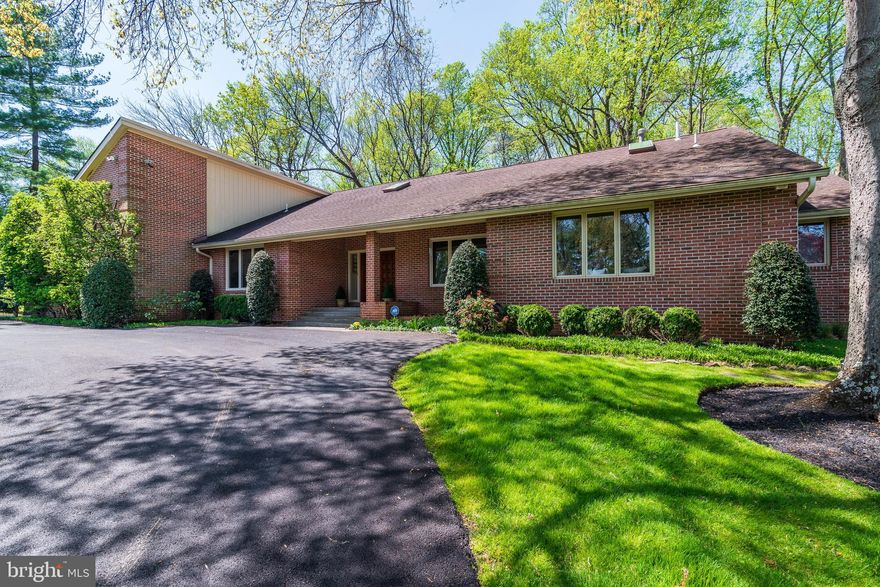 Don't miss this large custom contemporary rambler on two full finished levels, designed by noted Potomac builder Jack Greenspan on 1.3 beautiful manicured acres. The expansive residence offers over 6500 square feet of living space in a serene, private location approached via a long driveway.  The open floor plan provides large living spaces with soaring ceilings,  6 bedrooms, 4.5 baths, and main level living at its best. Three bedrooms including a large primary bedroom suite are on the main level. A walk-out lower level provides three additional above grade bedrooms plus family room, recreation and storage areas.  An expansive entry foyer welcomes one to the home, and leads to the wonderful Great Room with a grand floor-to-ceiling stone fireplace. A large updated chef's Kitchen with center isle offers ample food preparation space and cabinetry with attractive granite countertops. The Breakfast Room adjacent to the Kitchen is filled with light from skylights, and has French doors opening to the expansive Deck spanning the back of the house and overlooking the grounds. A  generous room works as an Office, additional bedroom or living room.  The elegant separate Dining Room allows for entertaining on a large scale. A large combination Laundry and Mud Room leads to the oversized two-car garage. The Lower Level matches the size of the main level, providing a Family Room with fireplace, three bedrooms, two bathrooms, and amazing storage spaces. Great design elements include high ceilings, large windows allowing views of the natural setting, skylights, hardwood floors, built-ins, lovely landscaping and a circular driveway. Located close to award-winning schools and a wonderful swim and tennis club, is ideal for multi-generational living and entertaining. Providing the feel of a vacation every day, this is a special property ideal for anyone desiring a beautiful, quality residence in an outstanding Potomac location. Note the floor plans.