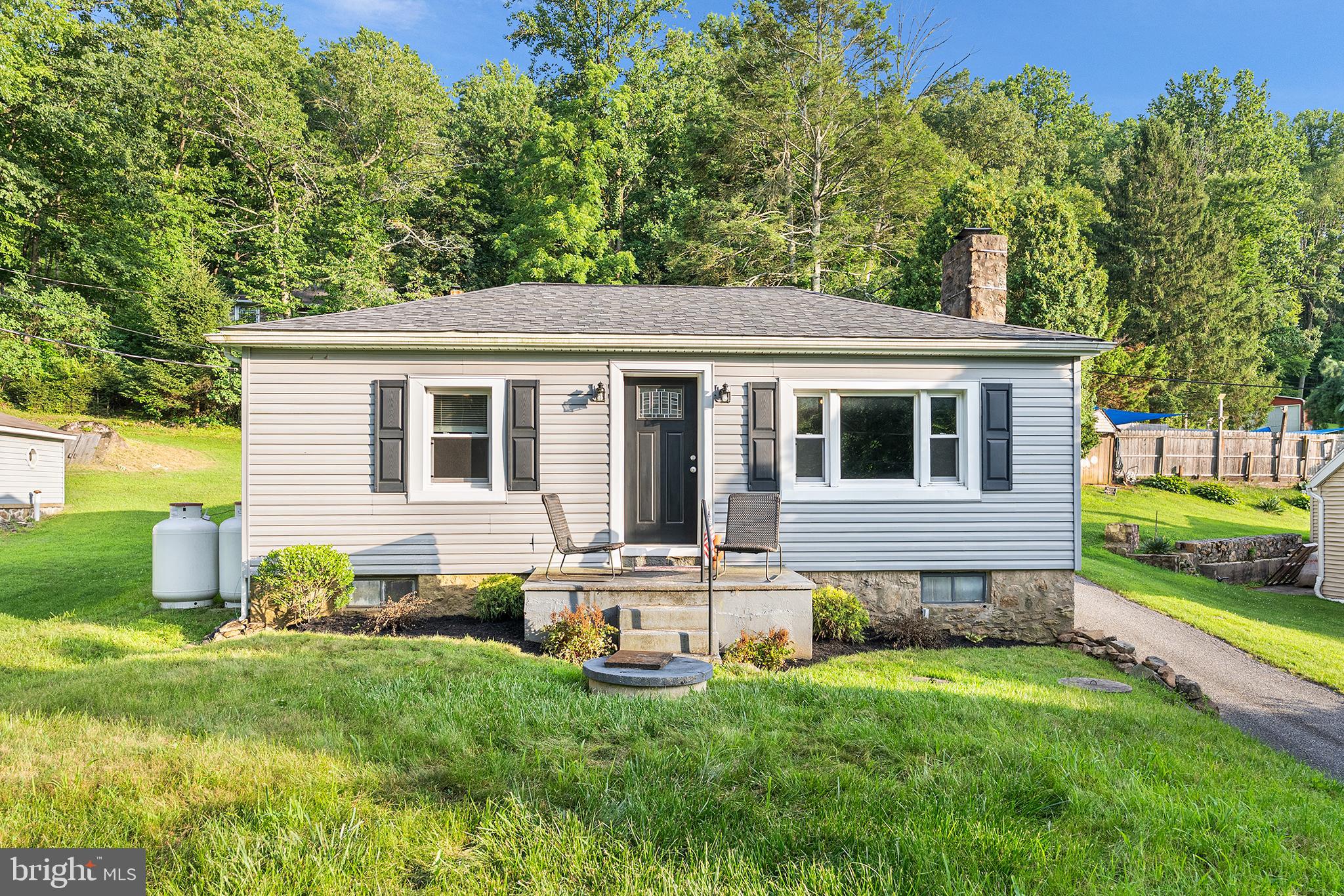 Have you been searching for the perfect suburban home in a highly sought after school system with a ton of natural light and a large fenced yard? If you value organic gardening, neighborhood camaraderie, creativity, and privacy look no further than this adorable meticulously cared for and recently renovated property in Hellertown. The inviting large front yard, luscious green grass and fresh manicuring with multi-car driveway parking checks so many boxes for buyers these days... and then you walk through either the front door or rear yard and realize this place has it all. Wood floors run straight through the living room into the kitchen with carpeting in all three bedrooms. Once through the sunny living room you'll find the open concept kitchen with stainless steel 4-piece appliances encased by shaker cabinets with matching stainless hardware. Before going through the full partially finished basement, take a stroll into the low maintenance rear yard with additional parking and included professionally installed whole house generator! After envisioning all the fun awaiting to be had back there, head back in to check out the large, high ceiling full basement that offers plenty of storage/workspace space on one side and additional office/living space on the other. Back up to the first floor to find three bedrooms all with ample closet space and ceiling fans. Why settle for a home that needs work when you can move right in and live stress free? The schools are right down the street, minutes to the Springtown Inn and so many parks. If you love the outdoors...this location is supreme. Do yourself a favor and don't wait to schedule your private tour and make this your best and easiest decision of 2025.