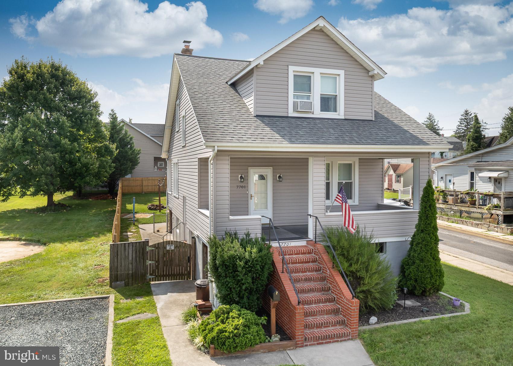 Open house Sunday 7/27 from 1:00-3:00. Set on a corner lot, this two-story gem is surrounded by lush grass, mature foliage, and timeless character! Brick steps leading to the elevated porch provide an attractive focal point, creating a peaceful spot to take in the sun or greet the neighborhood from your own private perch. Soft carpet and a minimalist chandelier furnish a warm introduction in the foyer and bright living room, while wood-style flooring and calming tones guide you further in. Your dining area offers a natural flow for hosting, with an adjacent alcove that features contemporary ceilings and lighting, perfect for conversational cocktails or relaxed solitary evenings. In the kitchen, you'll find sleek cabinetry and a stylish backsplash that blend functionality with flair. Upstairs, three comfortable bedrooms with ample closets share a full bath complete with a tub/shower combo. Whether you need restful retreats or purposeful workspaces, these rooms adapt with ease. The daylight basement adds plenty of opportunity for flexibility, be it a recreational room, a personal gym, or remote office. And when it’s time to unwind, the fenced backyard offers a firepit alongside a seating area just waiting to become a zen garden. Minutes from Double Rock Park, schools, shops, restaurants, and just a short drive to downtown Baltimore, this location balances urban accessibility with history, comfort, and potential. Come see how this home could embellish the next chapter in your life’s journey!