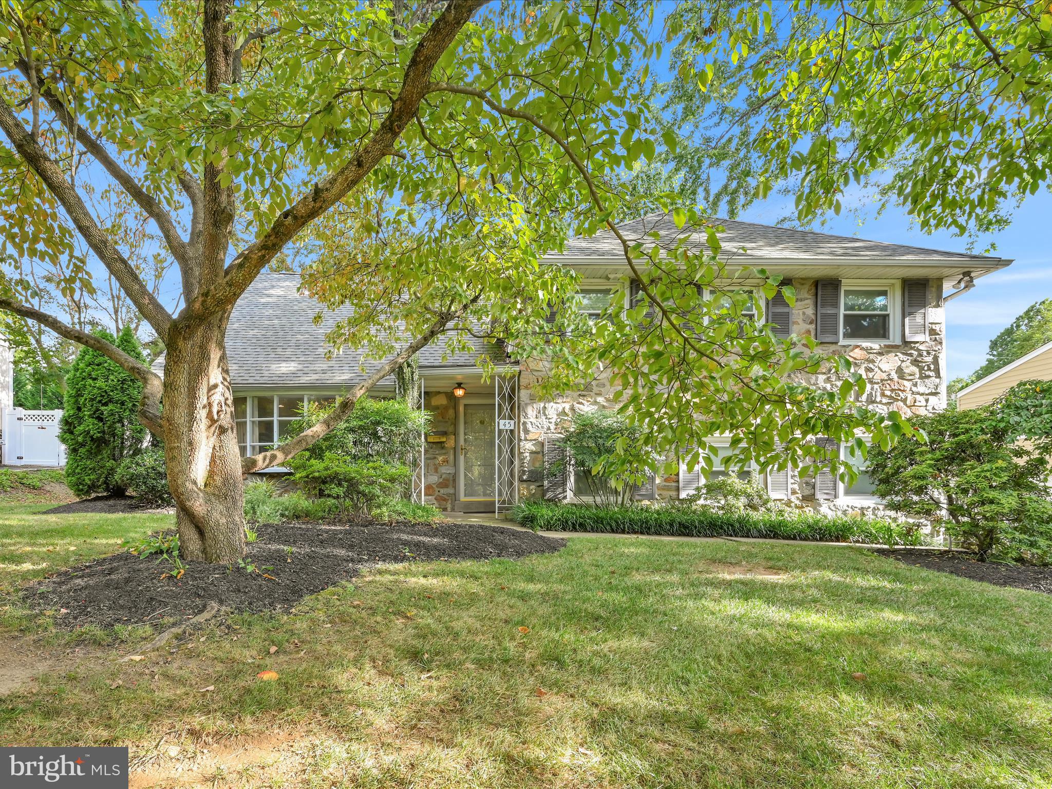 Beautiful 5 Bedroom stone split in sought after Marilyn Park. This spacious home features gorgeous hardwood floors. The gracious living room features a picture window with natural light. The large dining room is perfect for large or small entertaining. The updated kitchen has room for dining and an outside exit to rear yard. The upper level offers a private main bedroom with en-suite bath with marble vanity, plus two additional bedrooms and a hall bath. on the third level, you'll find two more bedrooms and a full bath-perfect for extended family, guests, or a home office setup. The lower level includes a large family room with powder room and sliders to a covered patio, ideal for outdoor entertaining. A finished basement
( not heated) provides even more living space, along with a laundry and "workshop room" for added convenience.