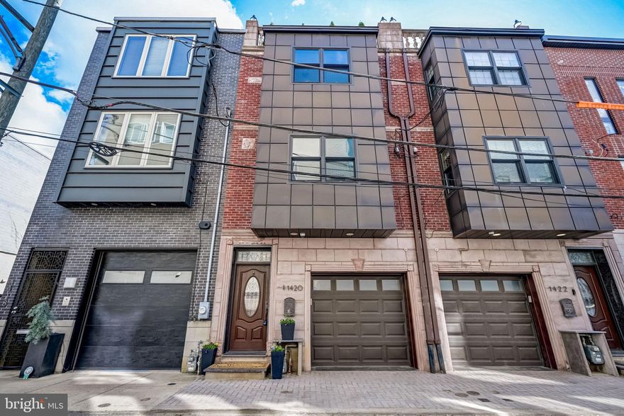 On a quiet, Graduate Neighborhood/Avenue of the Arts block, this stunning 4 bedroom + family room, 3 full and 2 half-bath home with 5 outdoor spaces and an oversized GARAGE has it all--Huge rooms and spaces, spectacular light, high ceilings, hardwood floors, solid core doors, recessed lighting, built-in speakers—all throughout the home. The high-end finishes include a spectacular chef’s kitchen. Huge open living area and large dining area. Full floor primary suite. Finished lower level with high ceilings (includes a large family room, bonus rooms, superb storage, and a half bath). Two-zone HVAC and fully sprinklered. This home simply offers superior space and volume, a superb layout, premier finishes, garage parking, and a superb Graduate/Avenue of the Arts location on a quiet no-outlet street just blocks from the best of what Center City has to offer. This immediate neighborhood is brimming with luxury new construction. With a 97 WalkScore, easy walk to Rittenhouse Row, Midtown Village, Avenue of the Arts, South Street’s Restaurant Row, Bella Vista, and more. This is a special home with quality finishes, parking, and superb spaces--both indoor and out.