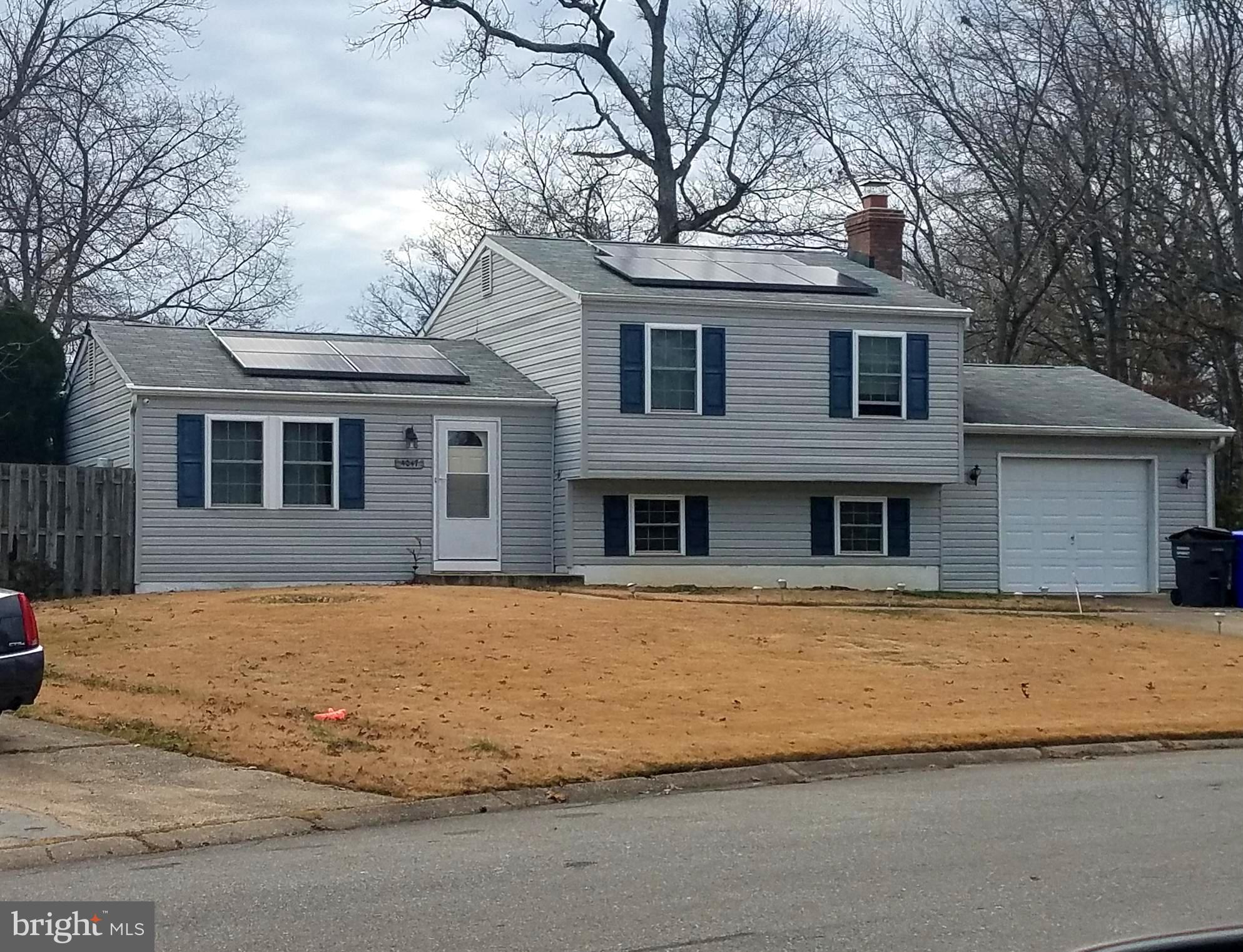This 3 bedroom split level home features an open floor plan with hardwood floors on main and upper levels! The family room on lower level has half bath. Over sized 1+ car garage and workshop/storage combo. Large, fenced back yard has patio off kitchen- great for entertaining! Community pool access and tot lots through out neighborhood. Close to shopping, schools and commuter routes. Pets on a case by case basis - $100 pet deposit per pet and additional pet rent will apply. $75 application fee per applicant.