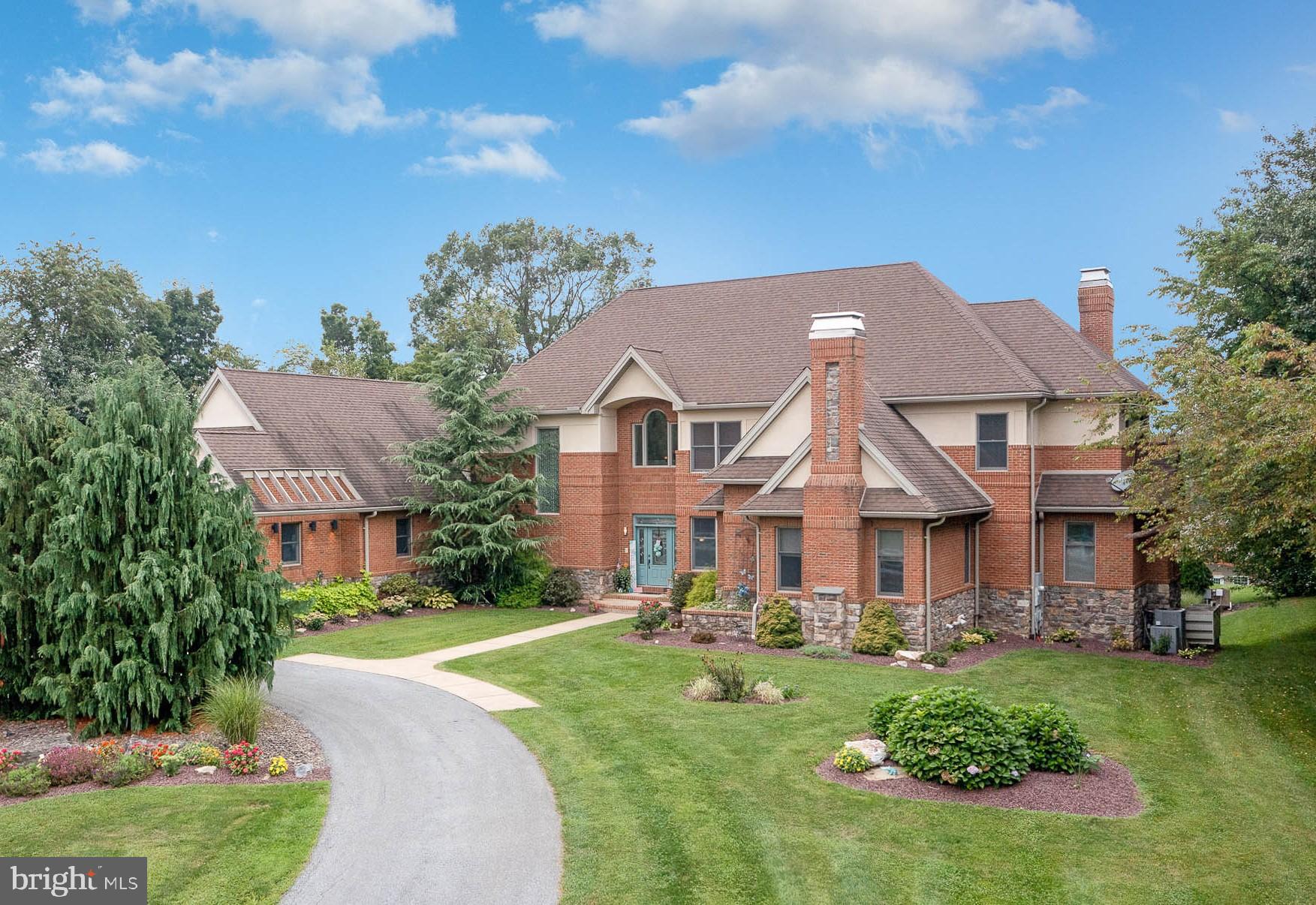 Discover the epitome of luxury living in this custom-built brick and stone estate majestically situated on over 12 acres of picturesque land. This stunning equestrian property boasts 7 spacious bedrooms, 7/1 bathrooms, and a versatile bonus room, offering an abundance of space for all your needs. An attached oversized side-entry 3-car garage, coupled with an attached rear-entry 1-car garage, provides ample space for your vehicles, lawn equipment and patio storage, complete with a dog bath.
Indulge in the lavish first-floor primary suite, complete with a cozy fireplace, a luxurious bathroom featuring a walk-in shower, and a grand soaking tub with its own fireplace. The custom kitchen is a chef’s dream, equipped with top-of-the-line Viking appliances and a charming breakfast nook overlooking the grand stone deck with stunning views.
.
The impressive, finished walkout basement opens a world of possibilities, including an additional bedroom, two full bathrooms, a great room, a family room with a fireplace, a wet bar, and a fully equipped kitchen. This space is ideal for hosting guests or creating a separate living area.
Once outside you will be in your private oasis, designed for ultimate outdoor enjoyment. The multi-level entertainment area features two outdoor fireplaces, a fire pit, and an inviting in-ground heated saltwater pool with 3 waterfalls. Approximately 4 acres are thoughtfully fenced pasture where you will find electric fencing surrounding 8 lush pastures and 1 paddock, along with 2 shed row stalls and 2 run-out stalls. A large pole building provides ample storage for hay and equipment, and a cement bottom manure pit ensures easy maintenance. For training and recreation, the property features grass fields and scenic trails perfect for hacking. There is plenty of space still available for an oversized outdoor arena for jumps.
Â
Additionally, the property includes four versatile outbuildings, adding further value and potential to this already impressive estate. The indoor riding arena was meticulously designed for both functionality and comfort. Constructed by the Amish in 2019, the facility features 10 spacious stalls with windows for optimal air circulation and comfort matting for horse footing. The highlight is the bright and well-lit 180’ x 75’ arena, equipped with an insulated ceiling and FICS of Maryland sand and rubber blend footing with MAG flakes, ensuring superior performance and dust control. Ride and train any time of the day.
Â
The arena includes a hot and cold wash stall, aisle ceiling fans, and a second-floor climate-controlled viewing room complete with a refrigerator, half bath, and a tack room. You will also find an additional heated tack room that offers a washer, dryer, sink, and instant hot water heater for convenience.
Â
This property is a rare find, combining luxury living, top-notch training facilities with picturesque surroundings, making it an ideal choice for an equestrian enthusiast of any discipline.
Â
Experience a lifestyle of unparalleled elegance and comfort in this remarkable property. Your dream estate awaits.