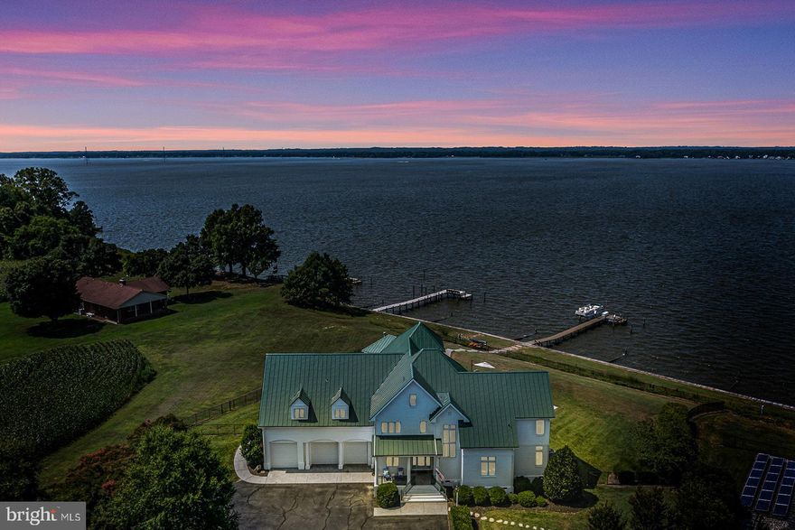 Welcome to 76 Level Green Landing! A truly distinctive waterfront property on the Rappahannock River! This Luxurious Estate has been designed with no detail left undone & features 3 levels of gorgeous style, 3 Car Garage, 7 bedrooms, 8.5 Baths (6 bedrooms are en-suites). The lavish interior features a beautiful entry Foyer, Gourmet Kitchen with all the bells & whistles, Island bar to seat 12+, Media Room/Den, Utility Room, Powder Room, Large open Dining Area, unique Great Room with Superior Views & soaring ceilings, Stunning Stone gas log Fireplace, Surround sound Wired throughout, main level owners Suite with whirlpool plus steam shower, Walk-in closets in 6 bedrooms, plus ample storage in the 34x 16 walk-in attic. Carefully Tailored to have water Views in almost every room & Still keep a striking Curb appeal both waterside and Roadside, this home is a "Show-Stopper" that must be seen in person to appreciate. The Entertaining areas flow seamlessly to the exterior w/ highlights such as : Salt water Pool, Wrap-around Screen Porch, extensive Patio area, Pool House w/kitchenette plus full Bath, outdoor Shower, Fenced yard & more. Other highlights include: Paved & Tree lined Driveway ,Brick exterior, Metal Roof, unique light fixtures & ceiling fans throughout, whole home automation system, plus so much more! The Very well Manicured & irrigated 2.64 acres makes it feel like a tranquil resort. The Shoreline is protected by a seawall & the long pier has a lounge area along with a boat lift. One Look will make any Buyer want to call this their Northern Neck of Va Home!!