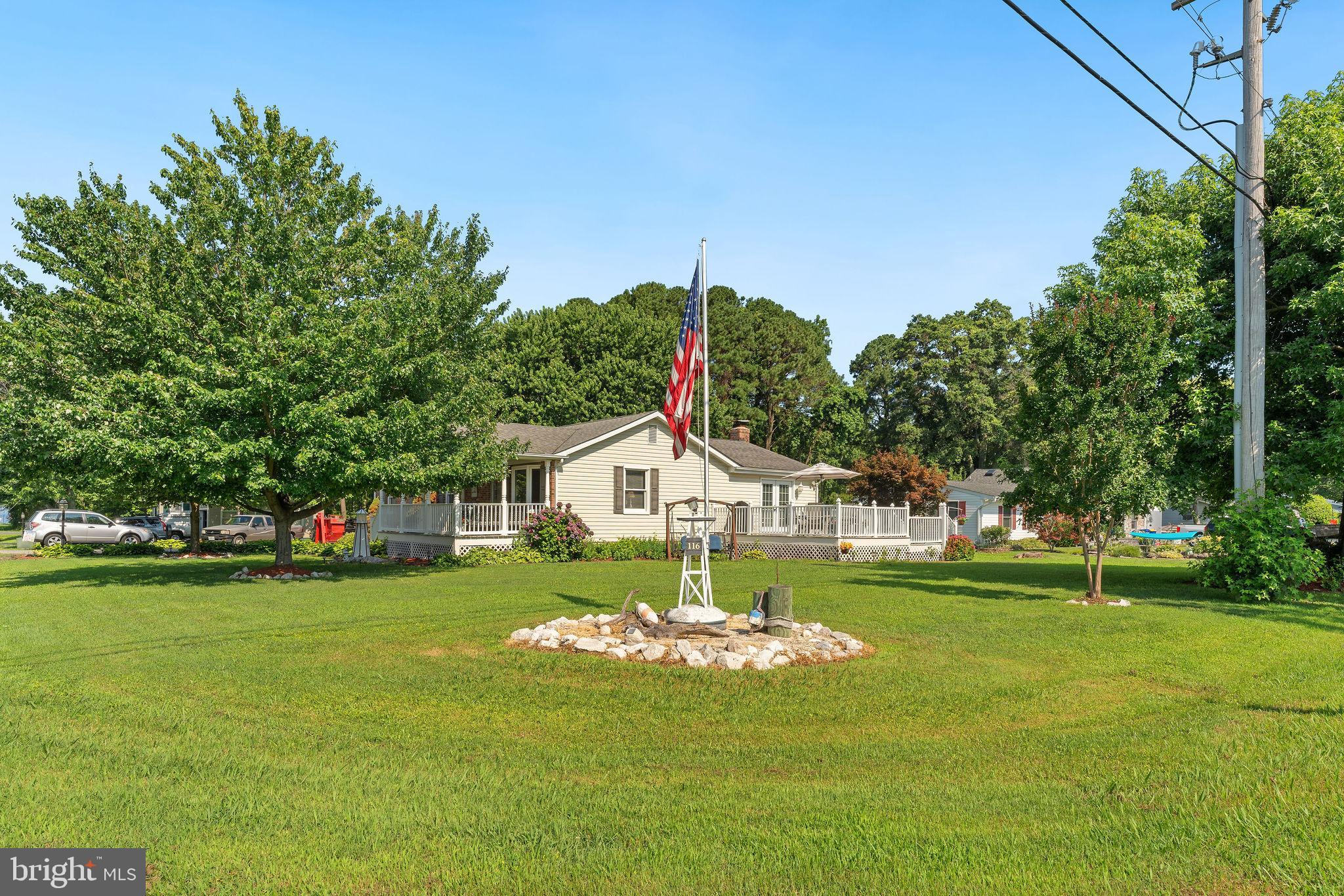*Freshly painted throughout, this move in ready home features a brand new well pump, HVAC system, stove, and refrigerator. Square footage differs from public records, it is closer to 1,900 sq ft, buyer to verify. For added peace of mind a 1 year home warranty is also included* Located in the storied area of Bloody Point, this lovingly maintained original-owner home offers a rare opportunity to enjoy peaceful, coastal living on Kent Island. Built in 1988 and thoughtfully expanded over the years, the home features 4 bedrooms, 2 bathrooms, and a spacious layout perfect for everyday comfort and entertaining. Enjoy custom additions including a huge family room with vaulted ceilings, a welcoming front porch, and two decks surrounded by extensive landscaping. Ideal for soaking in the quiet, natural beauty of the Eastern Shore. Outside, a large detached garage offers ample storage or workspace, and the camper hook-up provides flexibility for visitors or adventure-ready buyers. Just one block from the water and moments from the local marina and store, this location offers convenience and a true Eastern Shore lifestyle. Get in now to enjoy the lazy days of summer that lead into beautiful fall sunsets, and fresh local crabs, all from the comforts of your own yard. Whether you're seeking a full-time residence or a weekend retreat, this home offers comfort, character, and a coveted location.