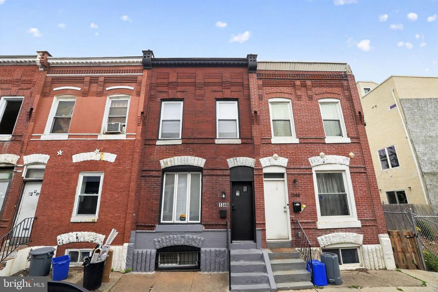Preserved character and modern upgrades. Open living and dining space with original wood floors and exposed brick wall. Continue into the brand new kitchen with all new tile floor, cabinets, stainless steel appliances, and counter. Private back patio with covered deck/steps and wooden fence. Upstairs has two spacious bedrooms, separate laundry room, and a full bathroom with new vanity. Clean, full basement. Two blocks from bustling Girard Avenue with great restaurants and shops.