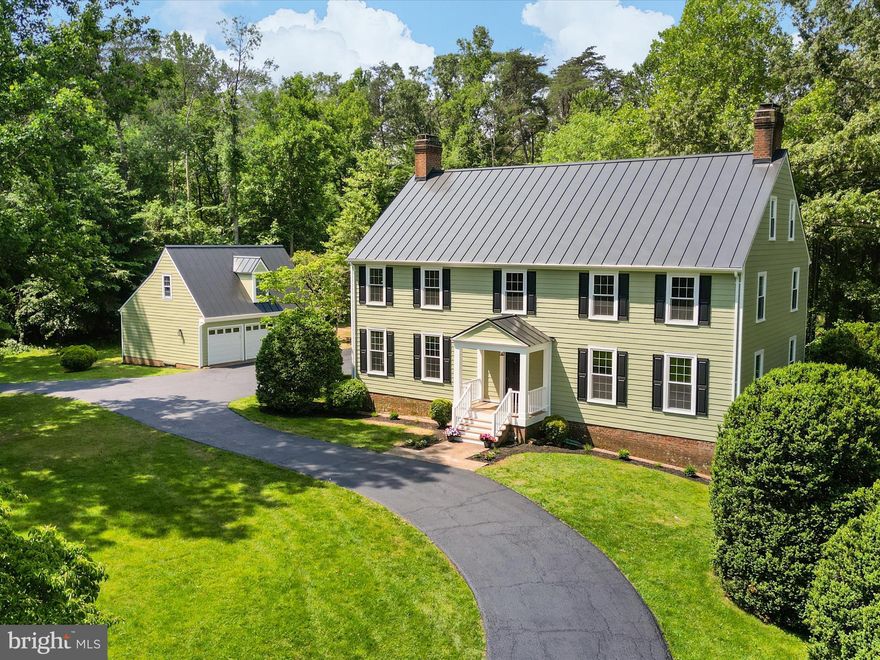 A Rare Clifton Offering! -- Welcome home to 6602 Ladyslipper Lane, an exceptional opportunity to own a 4 bed/3.5 bath meticulously renovated custom-built colonial farmhouse nestled on 5 serene acres. Modeled after an authentic Colonial Williamsburg residence, this tranquil property offers the perfect blend of modern upgrades and classic charm. With significant renovations completed in 2025 to ensure comfort, efficiency, and lasting value, every major component of the home has been upgraded or replaced—including roof, siding, windows, appliances, bathrooms, and more. 

The home and detached garage feature brand-new Hardie fiber cement siding (2025) and all-new windows (2025), enhancing curb appeal and energy efficiency. The roof was replaced with a standing seam metal roof on both the house and garage (2023/2024), and freshly painted exteriors with new gutters and downspouts (2025) ensure a polished and stunning presentation. All three porches were completely rebuilt and painted (2025), and new garage doors were installed (2025).

The interior has been professionally painted (2025) with a fresh, neutral palette, while maintaining the home's original reclaimed plank wood floors. The main level boasts 12 ft celings, a large entry, an eat-in kitchen with all NEW SS appliances, formal living and dining rooms, two fireplaces, and a cozy den/study  - all with sweeping pastoral views.

On the upper level, you'll find a primary suite with a renovated spa-like bath including a double vanity and dual-head shower (2025), 3 additional spacious bedrooms, and a split bath with a new toilet and double vanity (2025). A full-sized staircase from the upper level leads to an unfinished attic with ample ceiling height and a bathroom rough-in, offering the new owner immediate accessible storage space and future expansion options! NEED MORE STORAGE? The detached garage offers an attic storage space as well.

The lower level features brand-new luxury vinyl plank flooring (2025), a SECOND KITCHEN with all new SS appliances, another updated full bath (2025), two additional light-filled rooms (think guest room, craft room, home office, or gym) and a large recreational room with full-sized windows and French doors leading to a brick patio over looking the serene 5 acre lot. 

With every major component of the home recently upgraded or replaced—including roof, siding, windows, appliances, bathrooms, and more—this turn-key residence offers a rare opportunity to own a modernized home in a peaceful, private setting just minutes from downtown Clifton - IT IS A MUST SEE!