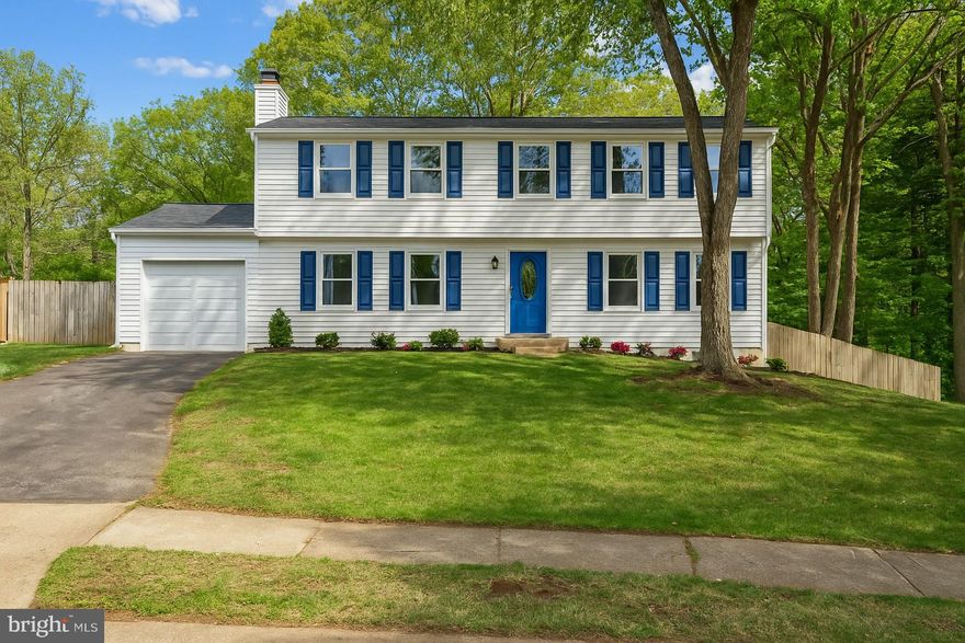 Welcome home! This stunning - and conveniently located - home has been thoughtfully renovated with stunning modern upgrades on all three bright and airy levels totaling nearly 3000 square feet!  Luxury vinyl plank flooring flows throughout the open floorplan, making the home ideal for entertaining friends and family. Inside the entrance, the living room is spacious with recessed lighting, elegant crown molding, and a wide, modern fireplace. Pass through the light-filled breakfast nook into the stylishly updated kitchen. Here you’ll discover abundant bright Shaker-style cabinets, sleek quartz countertops, and stainless steel appliances, including a contemporary range hood and enviable smart refrigerator. On the other side of the kitchen, the family room features a cozy fireplace, offering a second additional living space or welcoming home office. Luxury vinyl plank flooring continues upstairs, where the spacious primary bedroom boasts recessed lighting, a massive walk-in closet, and a sophisticated en suite bathroom with a double sink vanity and luxurious step-in shower. All three additional bedrooms include ceiling fans and wide closets, with shared access to the second chic full bathroom in the hallway. Downstairs, the lower level of the home offers a versatile recreation room with a wet bar and beverage refrigerator. Two bonus rooms and a third stylish full bathroom provide you with additional flexible spaces for a fifth bedroom, home office, or gym. Step outside onto the wide wooden deck to relax or entertain in the privacy of your giant .40 acre fenced backyard, surrounded by beautiful mature trees. On the front of the home, the attached garage and long driveway give you an abundance of space for both storage and parking. No HOA in this lovely, established community! Just minutes to Whole Foods, Wegmans, Springfield Town Center, Kingstowne,  Lake Accotink Park, Fort Belvoir, and The Pentagon. Quick access to Franconia-Springfield Metro Station, I-95, I-495, Franconia-Springfield Parkway, and the Fairfax County Parkway to easily travel and commute around the DMV. Schedule a private tour of your gorgeous new home today!
