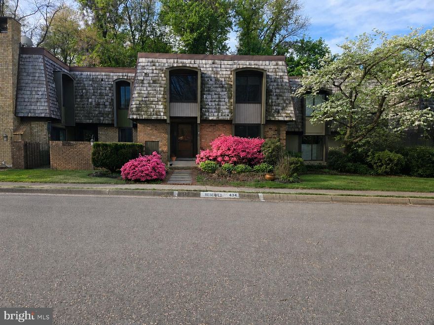 Warm and welcoming, spacious townhouse ideally located in a highly desirable community. The main level features hardwood flooring in the foyer, hallway, and dining room, creating a warm and inviting atmosphere. The expansive primary suite offers a comfortable sitting area, abundant closet space, and an updated en-suite bathroom. The upper level features two additional large bedrooms and an updated full bathroom, while the main level includes an updated powder room. The large kitchen is perfect for everyday living and entertaining, complete with a breakfast room, over-sized window, pantry, center island, refreshed  kitchen cabinets, granite counter-tops, and stainless steel appliances. The dining room opens to a beautiful patio and a maintenance-free fenced rear yard, ideal for relaxing or outdoor gatherings. Custom touches throughout the home include attractive beadboard panel accents and wooden shutters. Major updates include a  2022 HVAC system, carpet, replacement windows (2019), hot water heater (2018). The finished basement provides exceptional additional living space with two bonus rooms, a storage room, and a full bathroom. A unique feature includes magnetic paint on part of the office wall, adding both functionality and creativity. Conveniently located near public transportation and community amenities, including a pool with a large slide, tennis courts, and clubhouse. Do not miss out on this beautiful Gem!