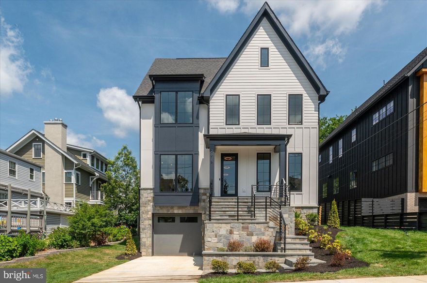 Now finished and ready to move in! Cherry Hill Custom Homes presents this beautiful custom home on one of the most sought after streets in Lyon Park. This home features 7 bedrooms, 7 full bathrooms, and 2 powder rooms with 6,060 square feet of finished living space on four levels. The main level includes 10ft ceilings, gorgeous wide-plank, white oak hardwood floors, and a beautiful gourmet kitchen with quartz countertops and frameless custom cabinetry. The kitchen overlooks a great room with coffered ceiling and gas fireplace with tile surround and a spacious breakfast nook for casual family dining. Through the butler's pantry is an elegant formal dining room with abundant natural light.  The in-set screened porch off the great room offers an amazing outdoor living space overlooking the backyard. A guest suite that can also be used as a office completes the main level. The upper level is highlighted by a luxurious owner's suite with a walk-in closet that dreams are made of, a spa-like bathroom with heated floors, dual vanities, and a heavy glass enclosed wet room with dual shower heads and a stand alone soaking tub. The loft level offers another full bedroom suite and common area, as well as a private outdoor terrace. The lower level includes an attached one-car garage and mudroom with built-in cubbies, a spacious recreation room with wet bar, exercise room, and additional bedroom with full bathroom. This home has a built-in elevator shaft for optional conversion. Convenient to Lyon Park and Zitkala-Sa Park, and just a half mile to Clarendon Metro and everything else in the heart of Clarendon.