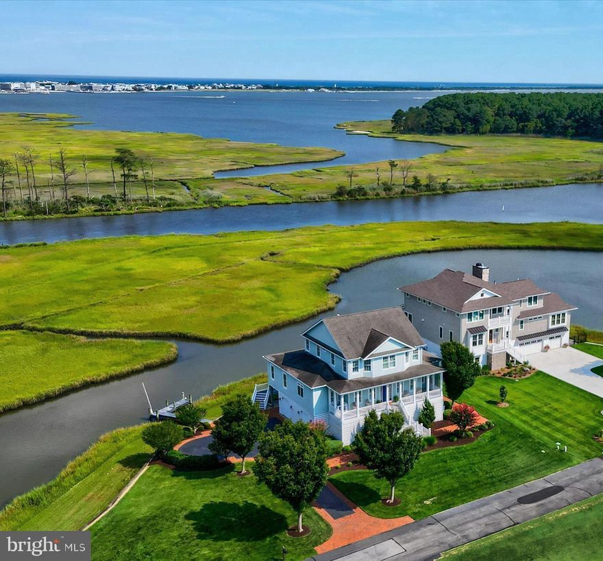 Rare offering of a direct  waterfront home in Rehoboth Beach with a private dock and deep water access near the mouth of the stunning Rehoboth Bay! One of only 4 homes nestled within a secluded enclave with a quiet, private drive;  just minutes to downtown Rehoboth.  This expansive, Key West style home boasts a half acre + lot with 244 ft of waterfrontage. Wake up to breathtaking, panoramic views of the Rehoboth Bay, private open space and protected serene views of the Thompson's Island Nature Preserve. The preserve, which is not only culturally and archeologically significant, is also home to dozens of species of birds and plants. 

This inspiring residence features a bright, open floor plan of 3400 square feet and 10' ceilings, 4/5 bedrooms, 4.5 baths, private office, formal dining room and  a gourmet chef's kitchen (complete with a 48" Sub-Zero side by side refrigerator/freezer). The centerpiece of the home is the living room, which is on axis with a wall of French doors overlooking  spectacular water views. Additional features include custom remote controlled blinds, remote controlled retractable deck awning and plantation shutters throughout with an elevator and whole house backup generator for your convenience. The luxurious owners suite features a whirlpool bath and walk-in roman shower room. Peaceful sunrises can be enjoyed in the east facing sunroom, owner's suite or breakfast room... all overlooking the Rehoboth Bay and nature preserve.