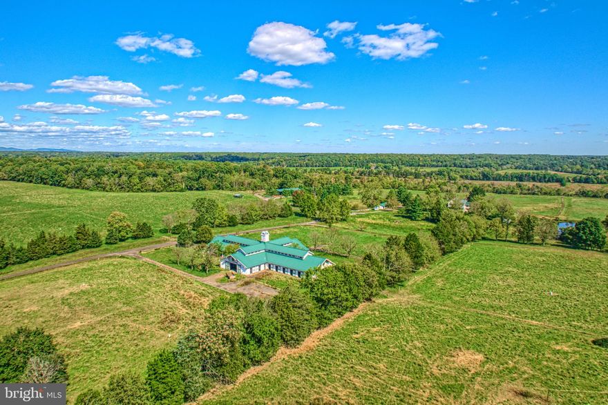 Welcome to Longwood Farm, tucked away in the gently rolling hills of Casanova, less then 5 miles southeast of Warrenton . The heart of the 774+/- acre farm is its 12,000-square-foot broodmare barn built in  2003 with 32  stalls, office and bath.  Surrounding the stable are auto water systems, two ponds, creek,  run-in shelters, and other improvements. The recently renovated center hall farm house is located in a stand of mature trees and offers views of the pastures, pond and barn.    The property, not in conservation easement,  consists of 16 parcels totaling 774 +/—acres. It has extensive road frontage along the east side of Rogues Rd as well as extensive frontage along the west side of Old Dumfies Road.
