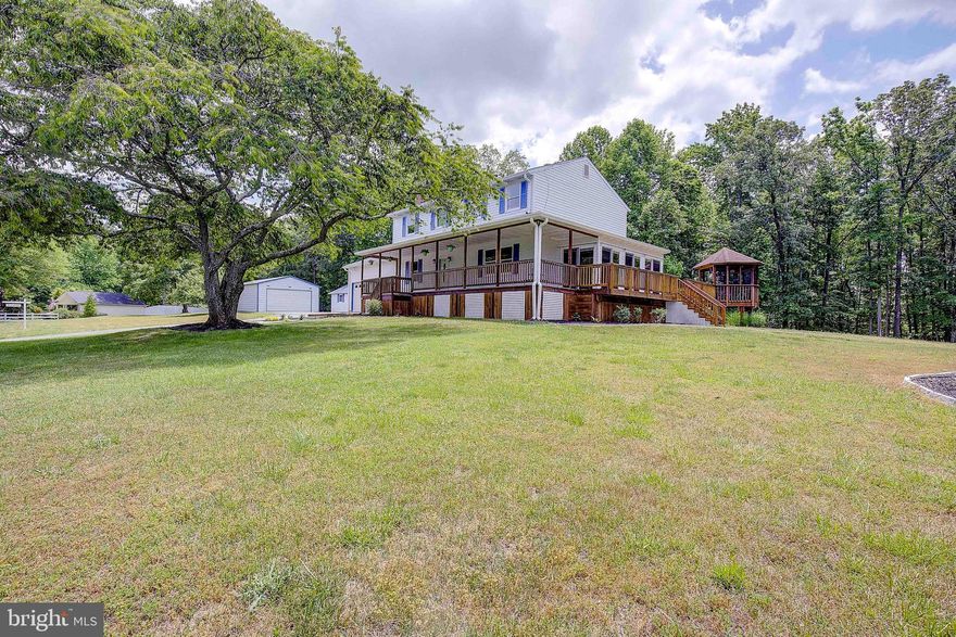 Welcome to the prime location of Huntingtown, Maryland, where your dream home awaits at 111 Amber Lane. First time offered for sale in a long time this traditional Colonial offers you features which many homes do not. This 4 bedroom 3.5 bath home is nicely located in Huntingtown just south of the 2/4 split putting you 35 miles to DC, 30 miles to Annapolis and 23 miles to Andrews Air Force Base.  Great location and an easy commute to the place you need to go! 

From the moment you drive up in the driveway you will LOVE the huge amount of parking for your family and the guys will be immediately drawn to the OVER SIZED 22x36  metal outbuilding offering you double roll up doors 16ft high in the front 10 ft in the back, with a drive thru, pavement floors, lighting and electric. The over sized shed also offers you its very own electric, outlets and lighting.  The workshop is 14x36.  This is a dream for anyone who is looking for a place to work at home, have a small home business or just a super awesome workshop too!  

The lot is a very nice level lot of 3 acres. Have your chickens, add a pool and more. Very private and spacious great for the kiddos and our 4 legged friends.  You will LOVE the yard it is unusual for such a great level lot in Calvert.  Perfect location and no HOA.  Come live the life you want.  

The wrap-around deck is such a nice feature to enjoy and the gazebo is superb for summer meals outside overlooking the yard. The deck is newer and recently stained so you do not have to do it.  The inside of the home has been freshly painted and new flooring in some areas and offers a ton of space for everyone. The 4 bedrooms are good sized and the bathrooms are equally as good.  Newer lighting and more. The primary bedroom offers a large walk-in closet and a nice bathroom too!  On the main level there are plenty of places to use including 2 sunrooms, 2 family rooms and an large eat-in kitchen.  The basement offers a 2nd fireplace and 2 large rooms and an additional full bathroom.  Turn the basement into an In-law apartment or rent it out for additional income the choice is yours!  

Many upgrades in the past few years to include the roof and siding only 6 months old.  The deck 2011, pellet stove cleaned 2023, septic pump out 2020, metal building 2016, inside HVAC 7 yrs old exterior unit 2022.Well cared for home.  Come and get it while you can.  The solar panels are with Tesla and are on a 20 year lease with 11 years left. Seller will not move panels or pay off the lease. See the savings in the lease on the electric. No monthly lease bill.  

Don't miss out on this extraordinary opportunity to own a fantastic retreat in Huntingtown, Maryland. Schedule a visit today to experience the charm and elegance that awaits you at 111 Amber Lane. Your dream lifestyle begins here!