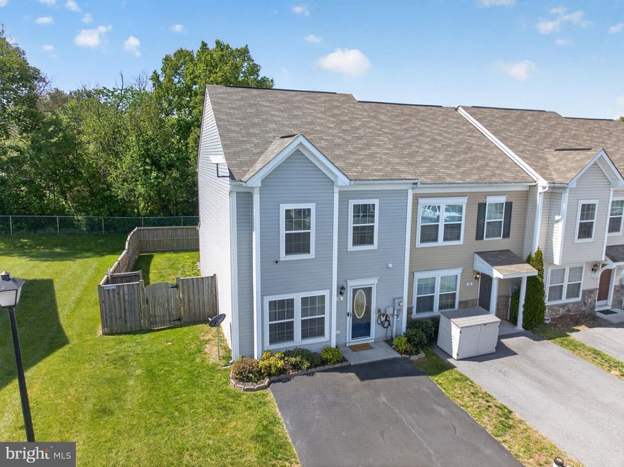 Well-updated and maintained, this single-owner townhouse is loaded with desirable upgrades that provide a combination of privacy and convenience.  As an end unit, the three bedroom townhouse features a fully fenced rear yard that is set against a thick row of trees that creates a quiet retreat, plus an attached secured storage shed and a large patio that is perfect for enjoying the outdoor space.  The front entryway features a large driveway that can park multiple cars, a fully installed electric car charger, and a storm door that opens into a large family room with LVP flooring, a bay window, and a convenient office cubbie that is hidden behind a stylish set of barn doors.  The large eat-in kitchen features stainless steel appliances, an island with counter-height seating, and a separate dining space, plus a built-in coffee and wine bar that is adjacent to the outdoor patio.  Upstairs is a beautiful primary bedroom and bathroom suite that features a dual vanity, stylish open shelving, and a large walk-in closet, plus two guest bedrooms that share a second full bathroom.  Upstairs laundry conveys with the sale.  Owner is offering a one-year warranty with an acceptable offer.