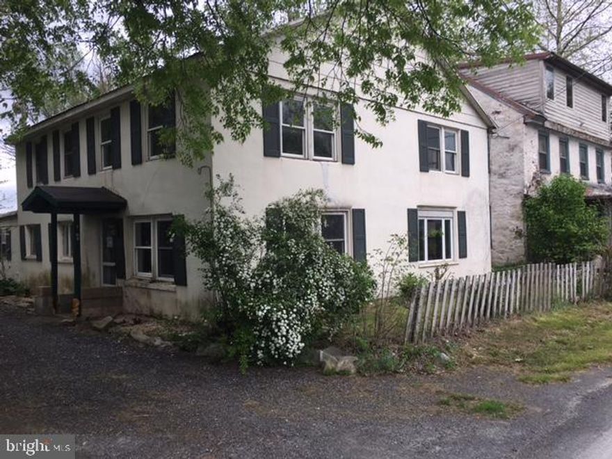 Large 2 story home zoned mixed use with lots of potential. Beautiful cherry hardwood floors and trim, huge kitchen. Property is eligible under the Freddie Mac First Look Initiative (owner occ preference period) thru 07/22/17. * Flood insurance is required if financed.